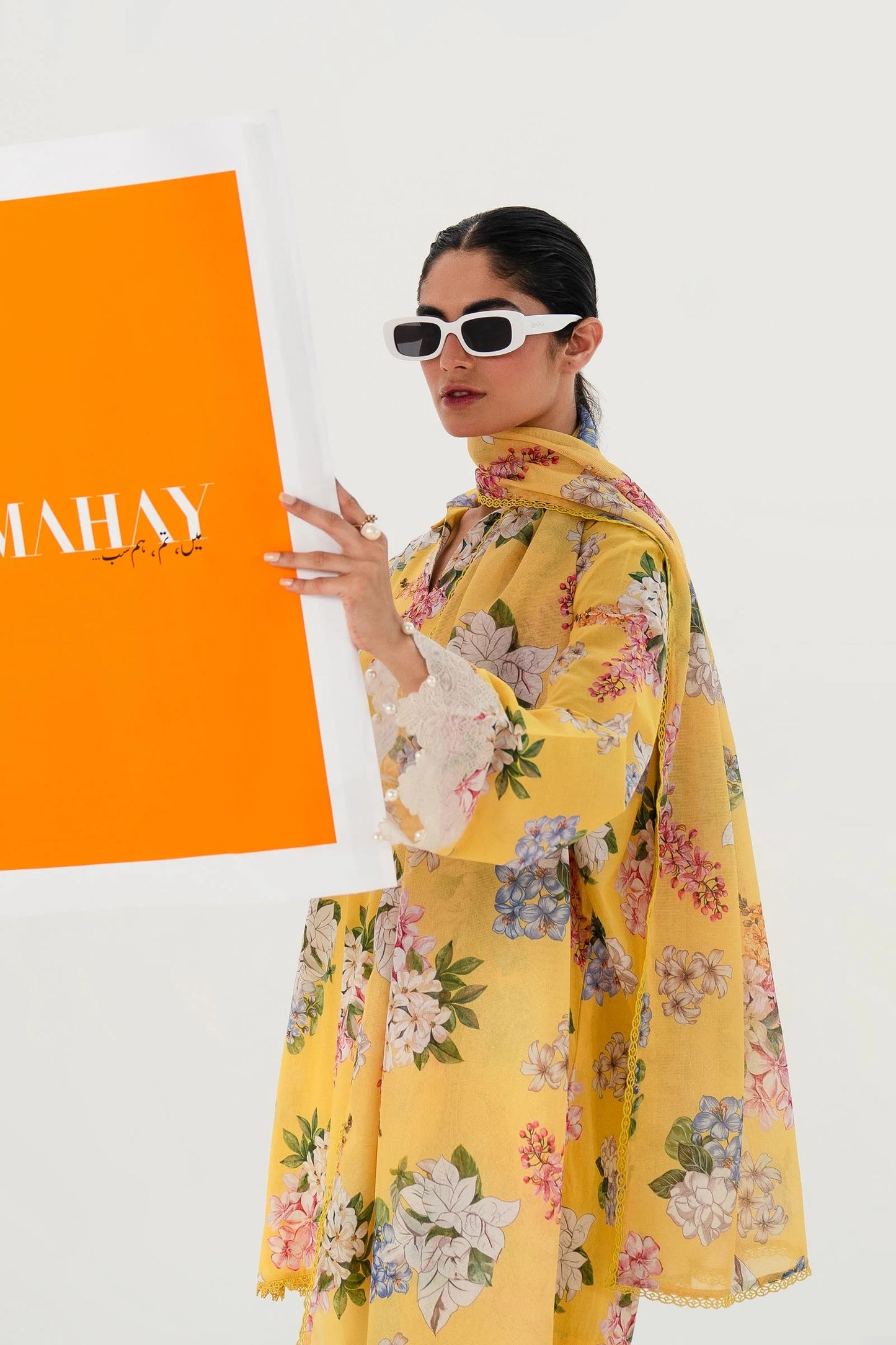 Model wearing Sana Safinaz Mahay'24 yellow floral lawn suit, bright summer outfit in UK.