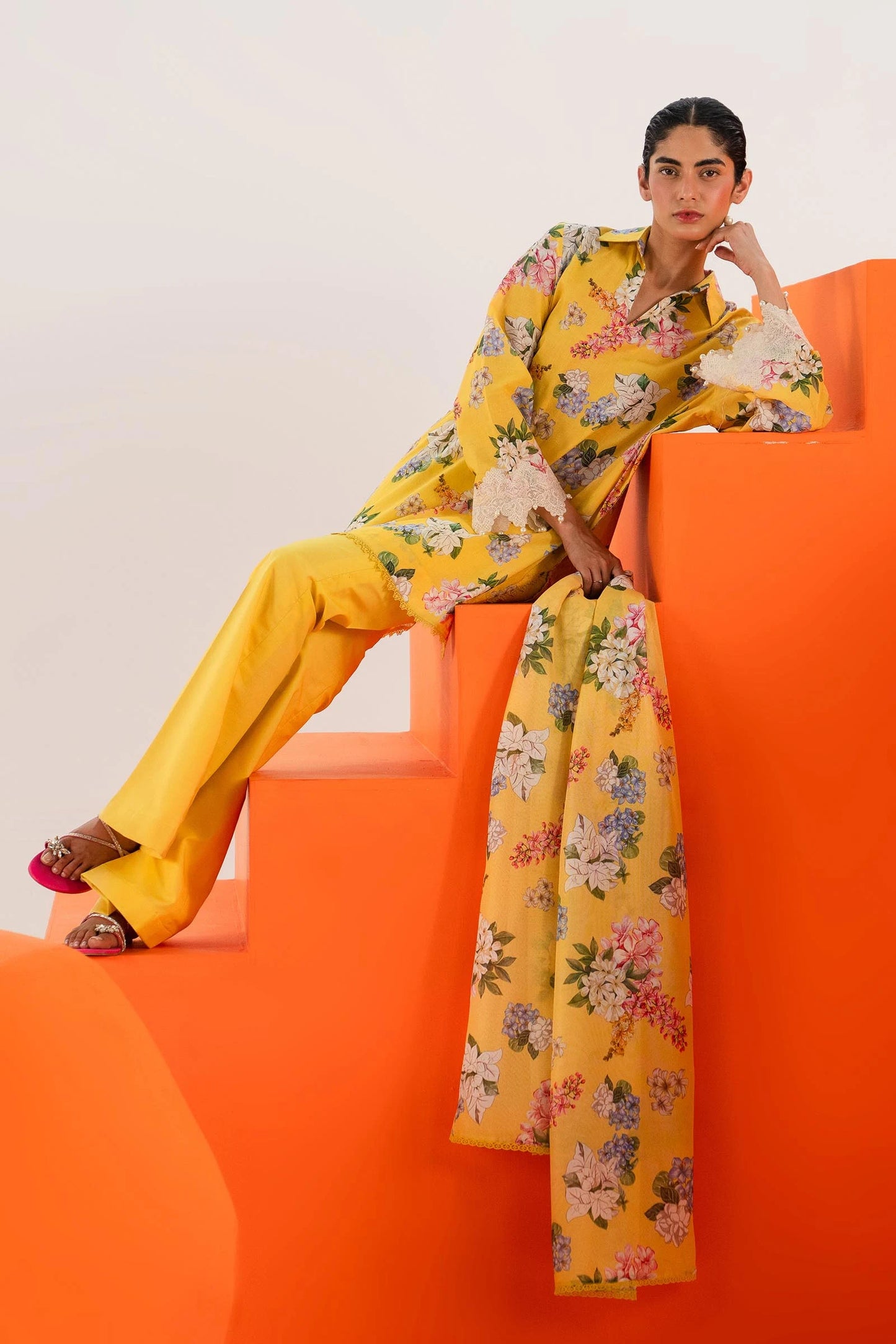 Model wearing Sana Safinaz Mahay'24 yellow floral lawn suit, bright summer outfit in UK.