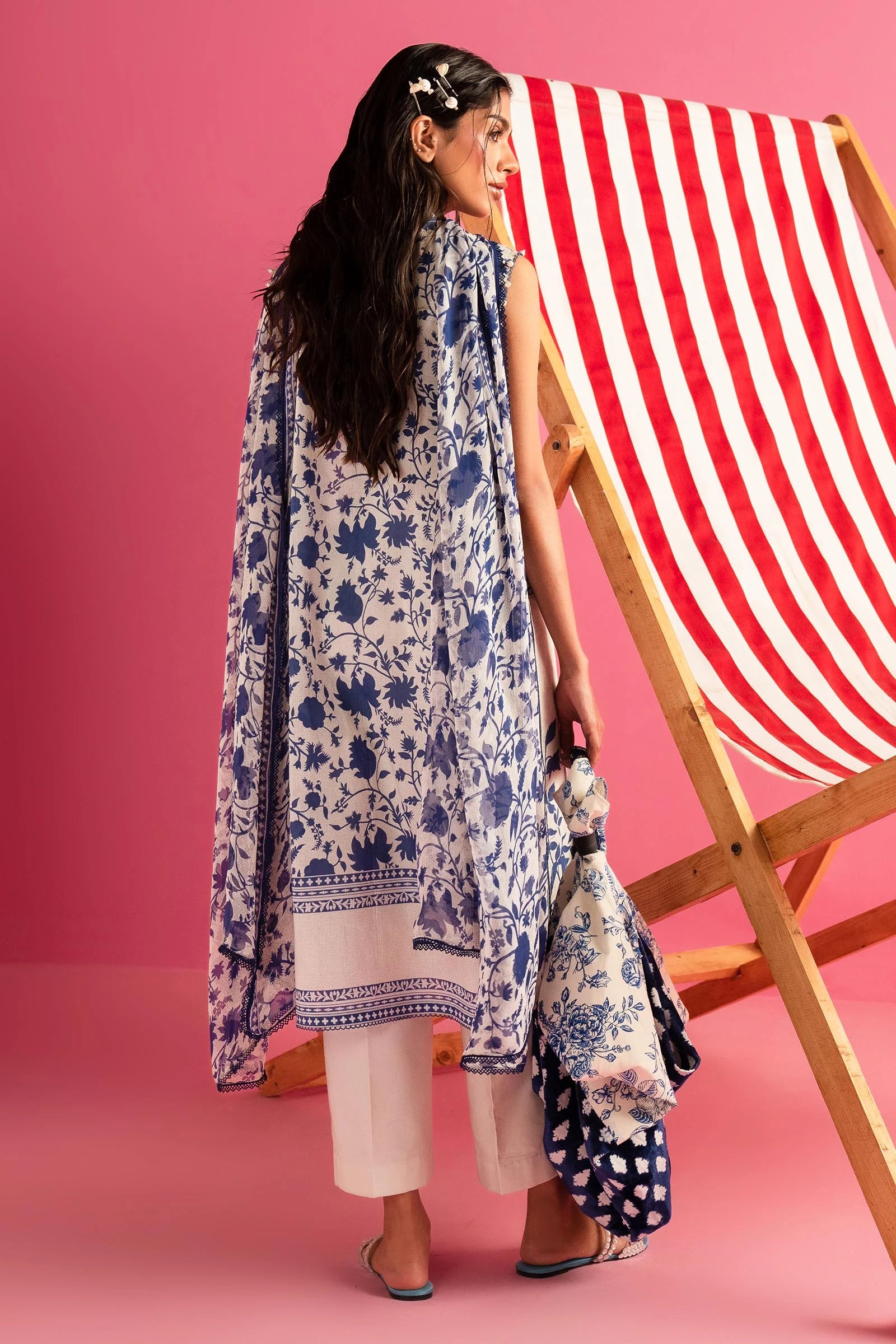 Model wearing Sana Safinaz Mahay'24 cream and blue printed lawn suit, trendy Pakistani fashion in UK.