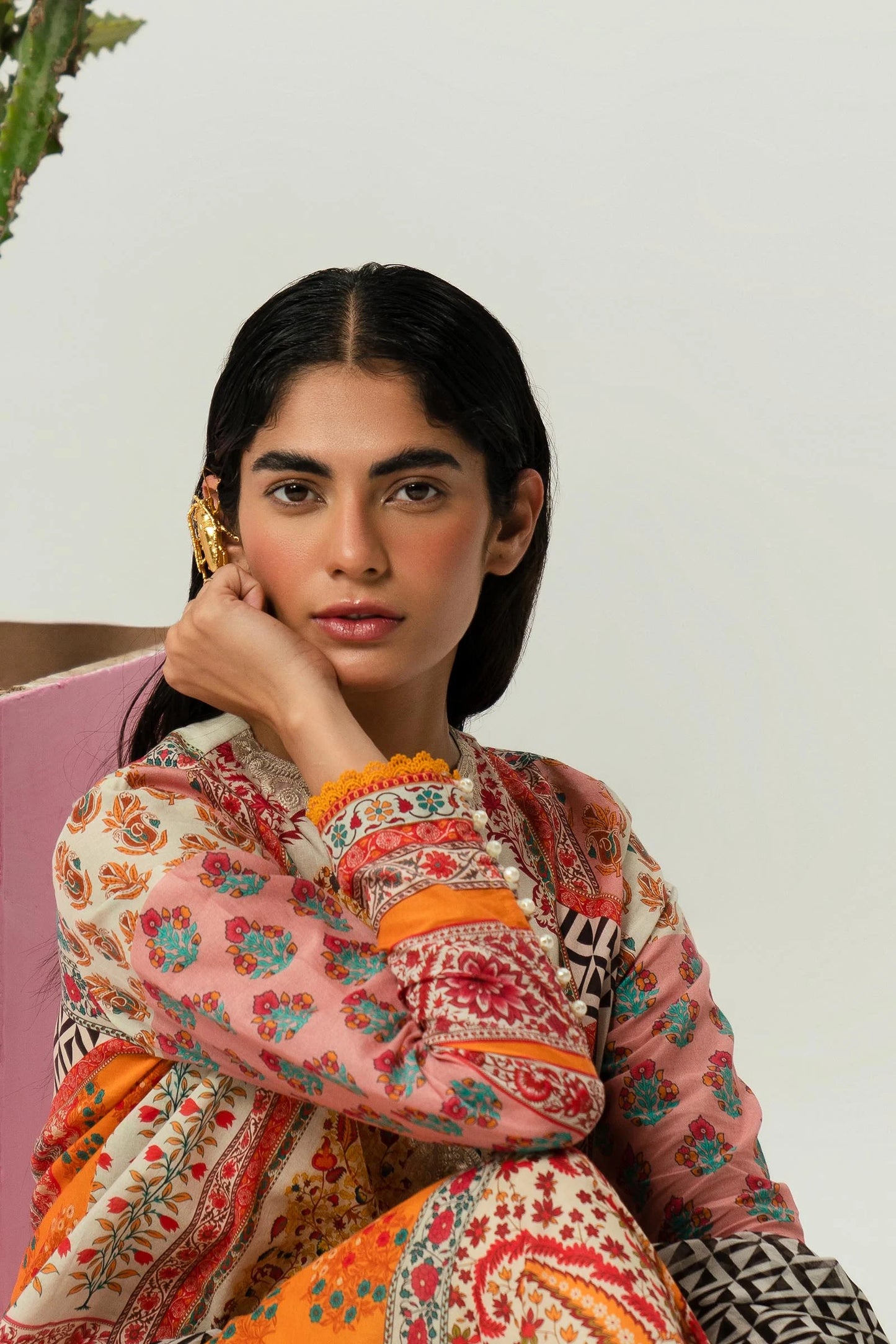 Model wearing Sana Safinaz H242 - 013B - 2I orange Pakistani lawn suit with black and white dupatta.