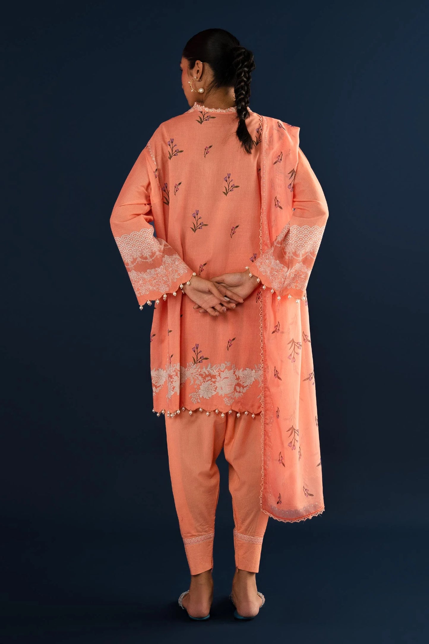 Model wearing Sana Safinaz H242 - 014A - 3CK peach embroidered Pakistani lawn suit.