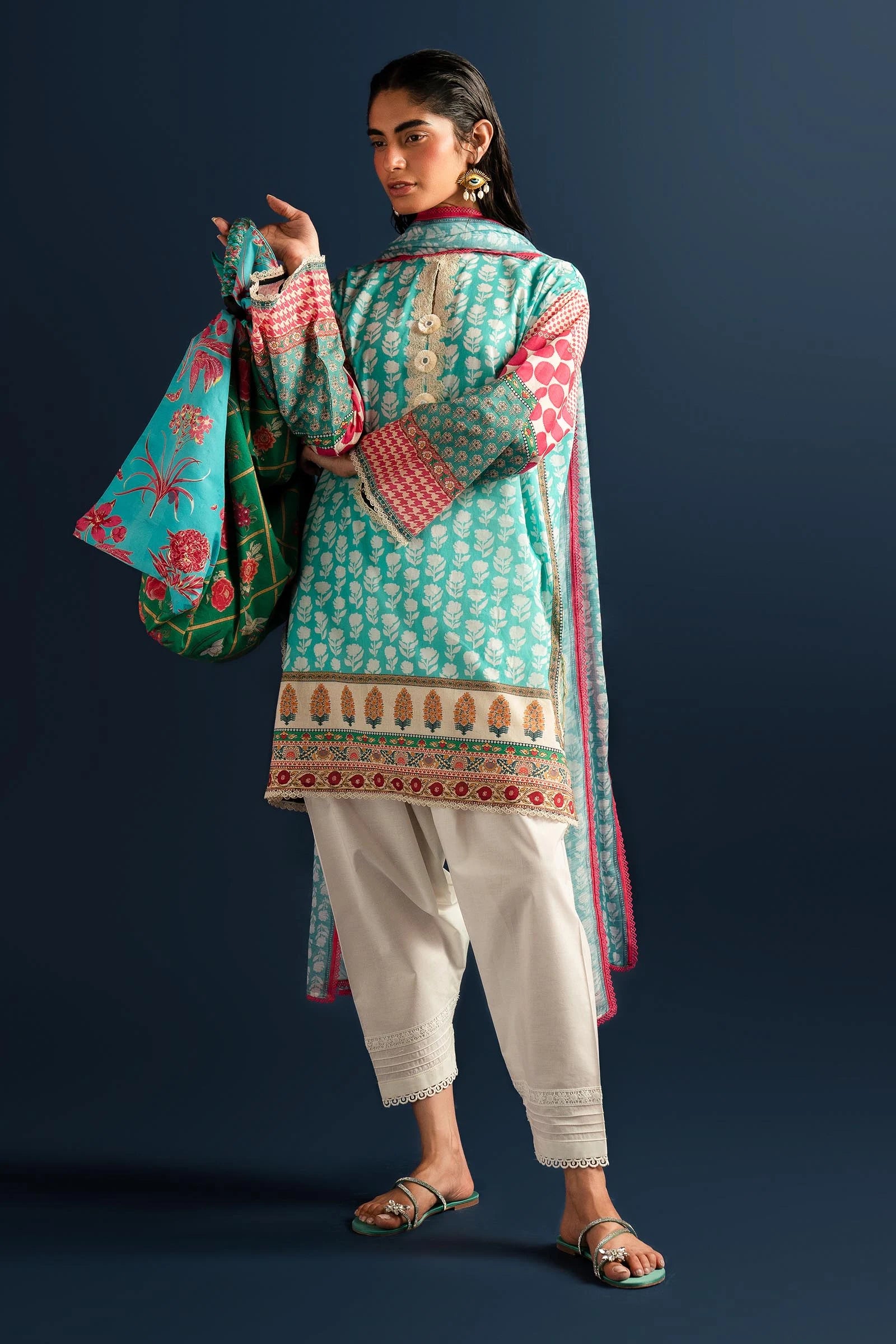 Model wearing Sana Safinaz turquoise and pink lawn dress, Pakistani summer fashion in the UK.