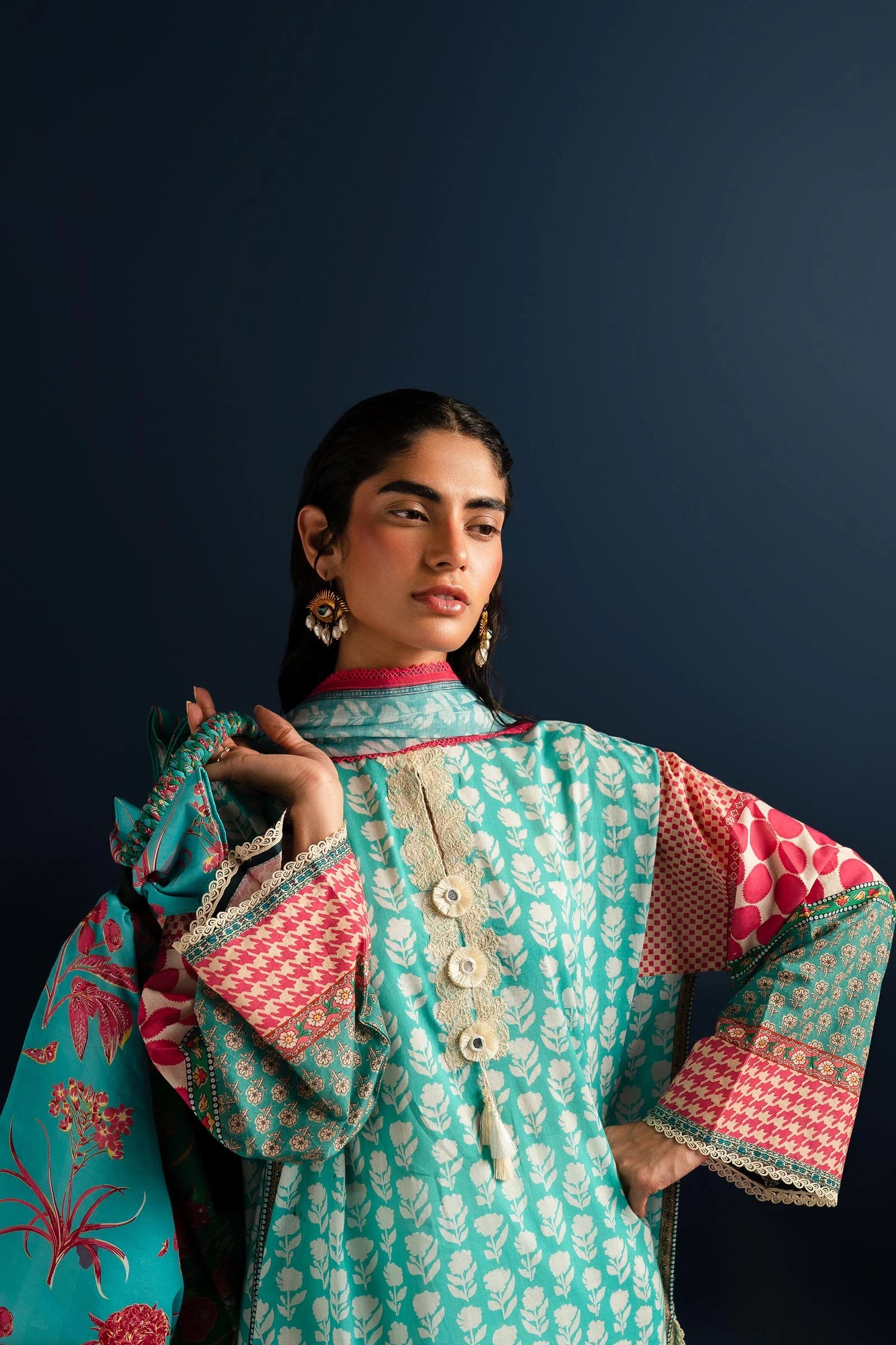 Model wearing Sana Safinaz turquoise and pink lawn dress, Pakistani summer fashion in the UK.