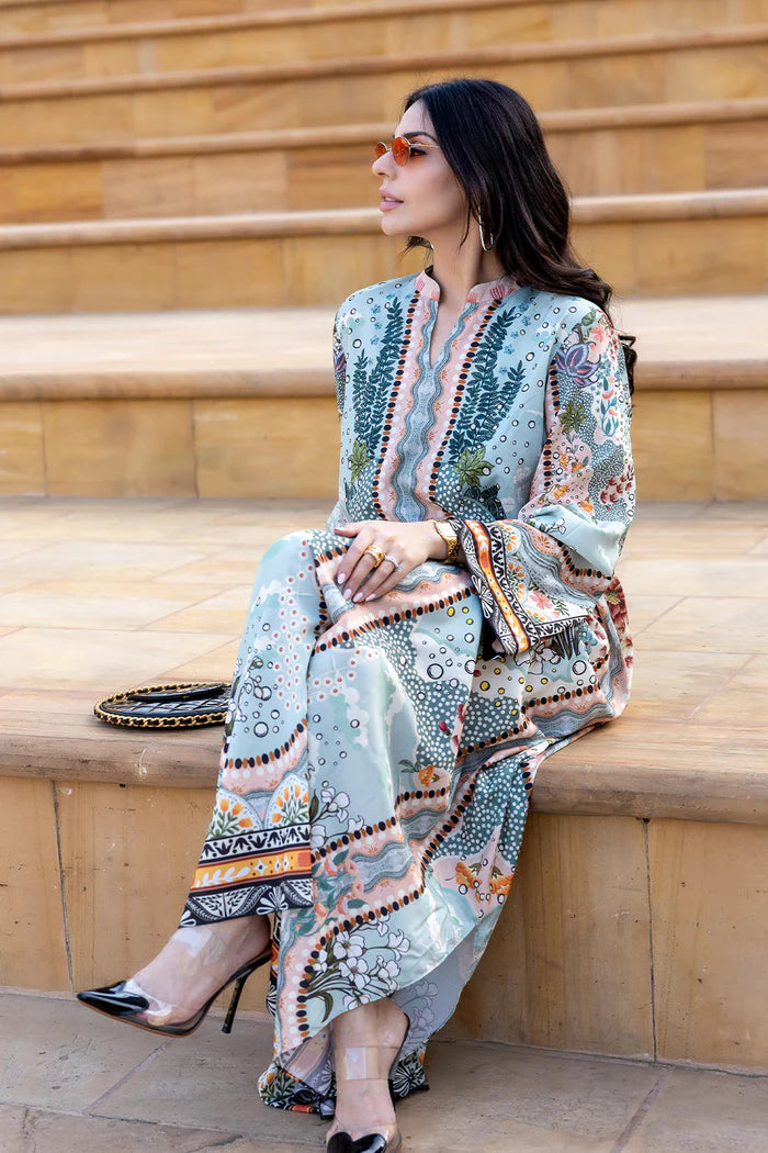Model wearing multicolour printed long kaftan-style dress with flared sleeves from Saira Rizwan, Pakistani luxury pret, Pakistani clothes online in UK.