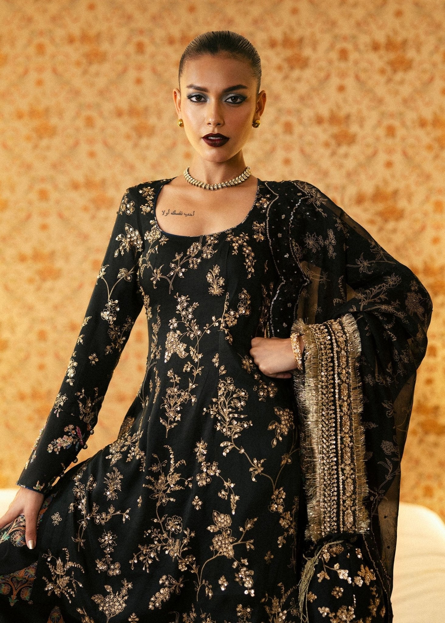 Model wearing Auric from Hussain Rehar's BASIC NOT BASIC V collection in radiant gold. Festive wear, Pakistani clothes online in UK.