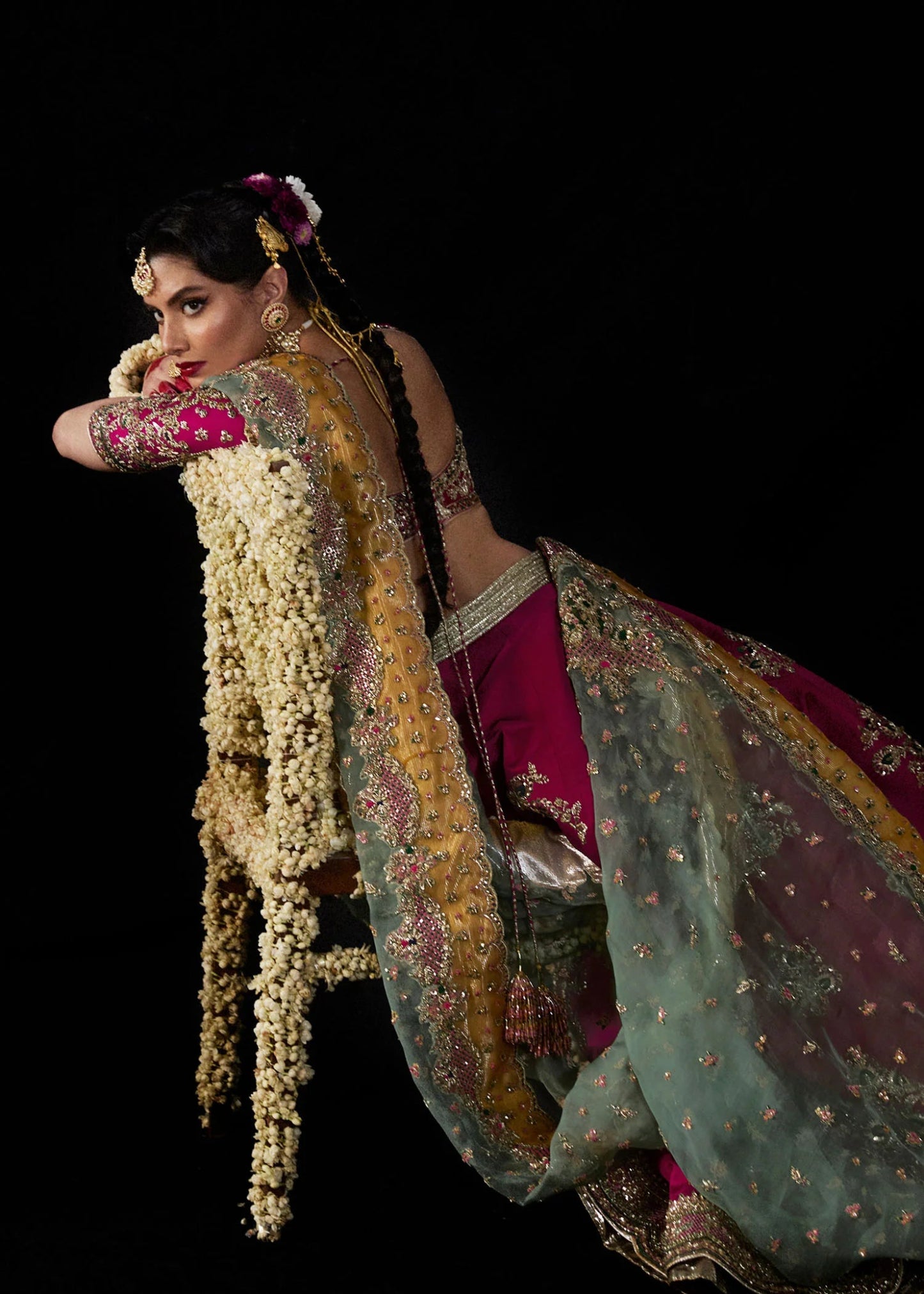 Model wearing Laal from Hussain Rehar's Bridal Couture '24, featuring intricate bridal design. Pakistani clothes online in UK.