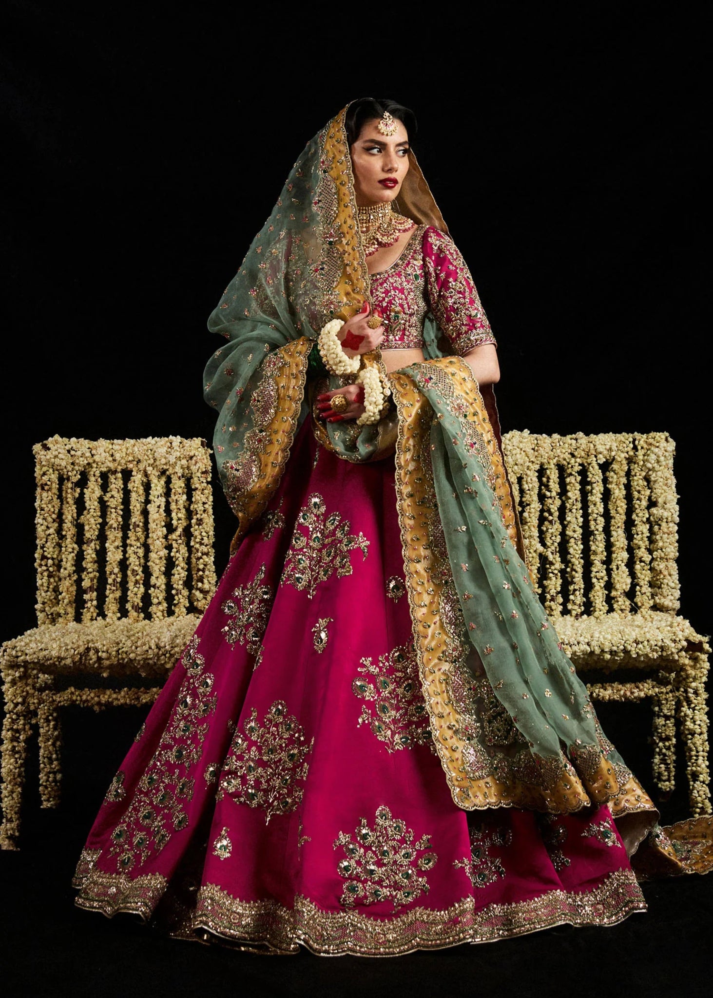 Model wearing Laal from Hussain Rehar's Bridal Couture '24, featuring intricate bridal design. Pakistani clothes online in UK.