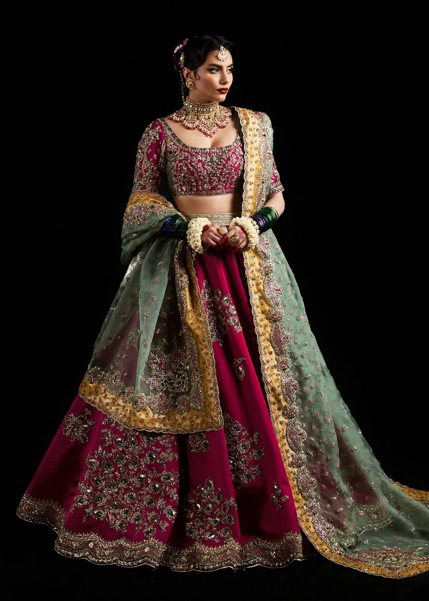 Model wearing Laal from Hussain Rehar's Bridal Couture '24, featuring intricate bridal design. Pakistani clothes online in UK.