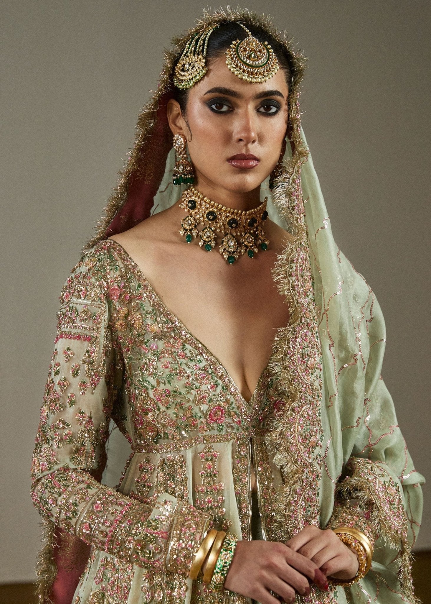 Model wearing Parwan from Hussain Rehar's Bridal Couture '24, featuring luxurious bridal details. Pakistani clothes online in UK.