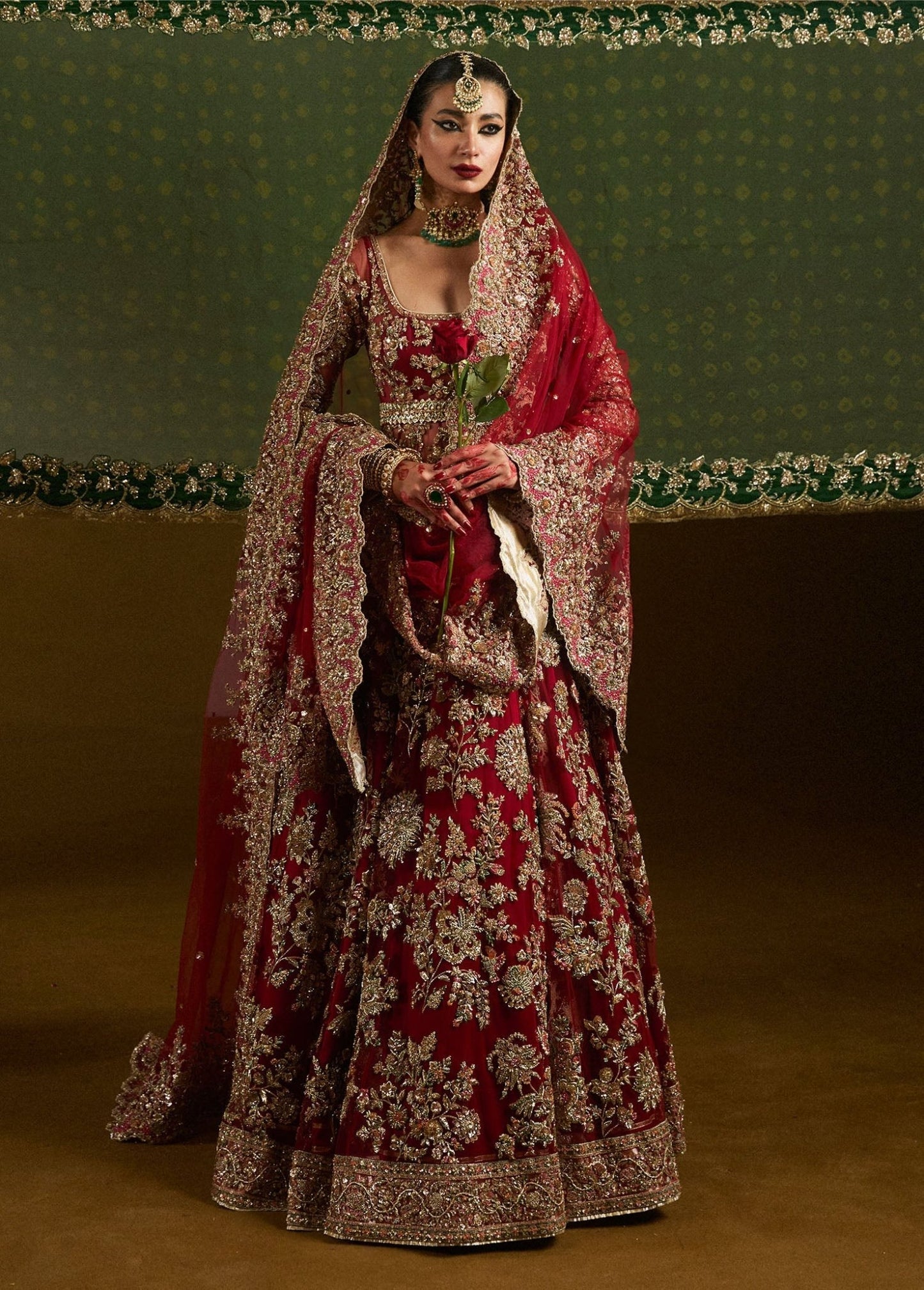 Model wearing Qashqaye from Hussain Rehar's Bridal Couture '24, exuding luxury and elegance. Pakistani clothes online in UK.