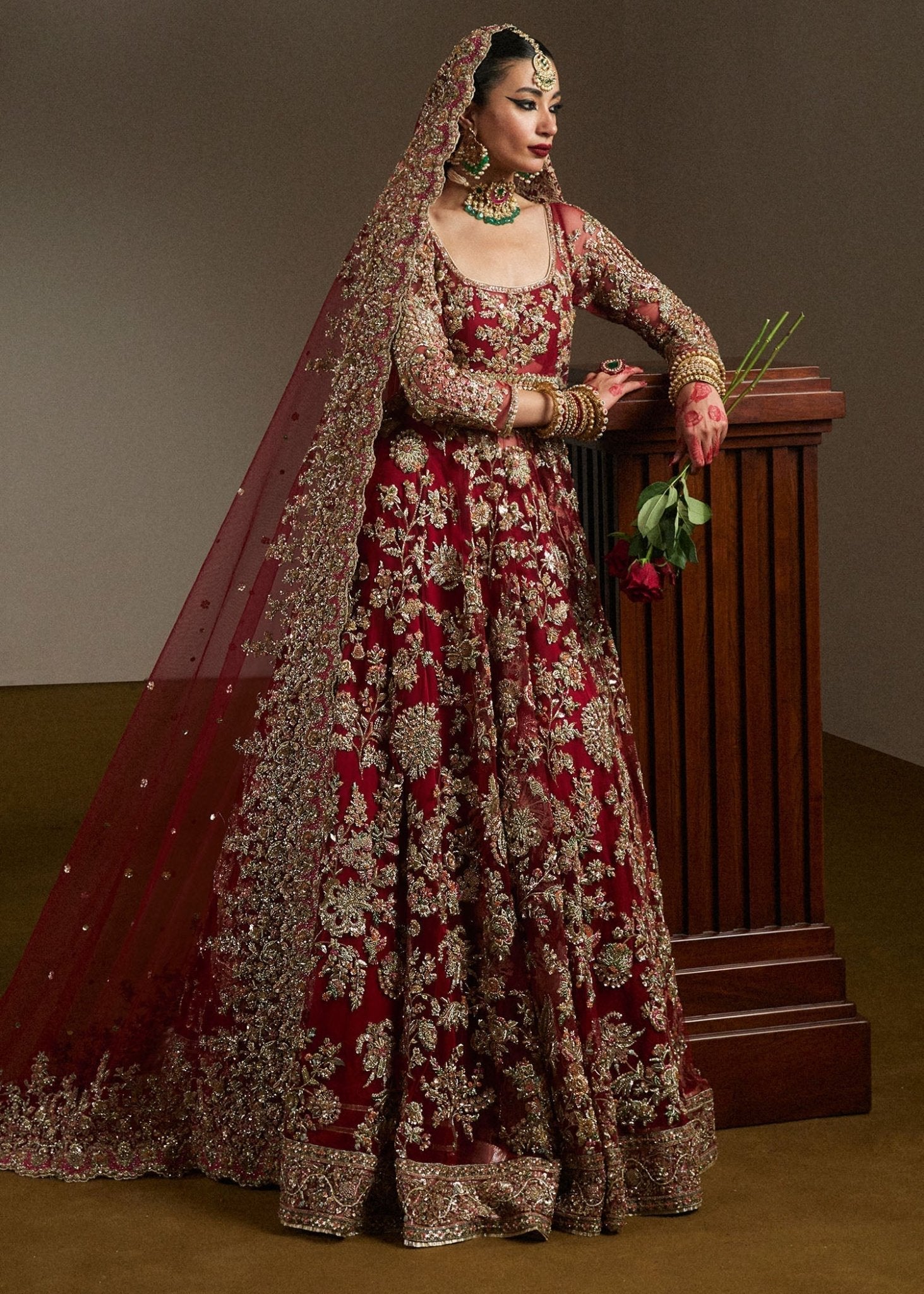 Model wearing Qashqaye from Hussain Rehar's Bridal Couture '24, exuding luxury and elegance. Pakistani clothes online in UK.