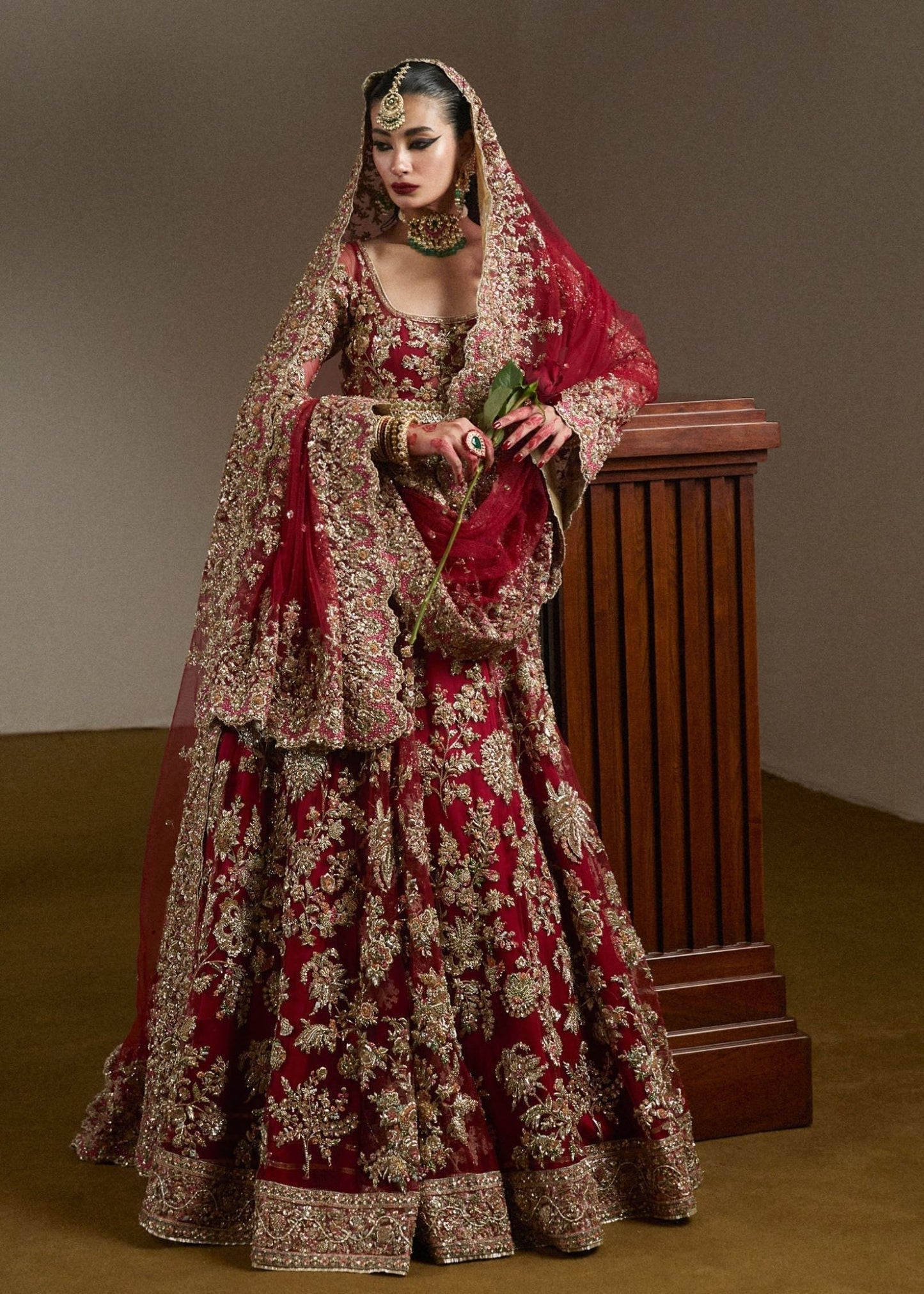 Model wearing Qashqaye from Hussain Rehar's Bridal Couture '24, exuding luxury and elegance. Pakistani clothes online in UK.