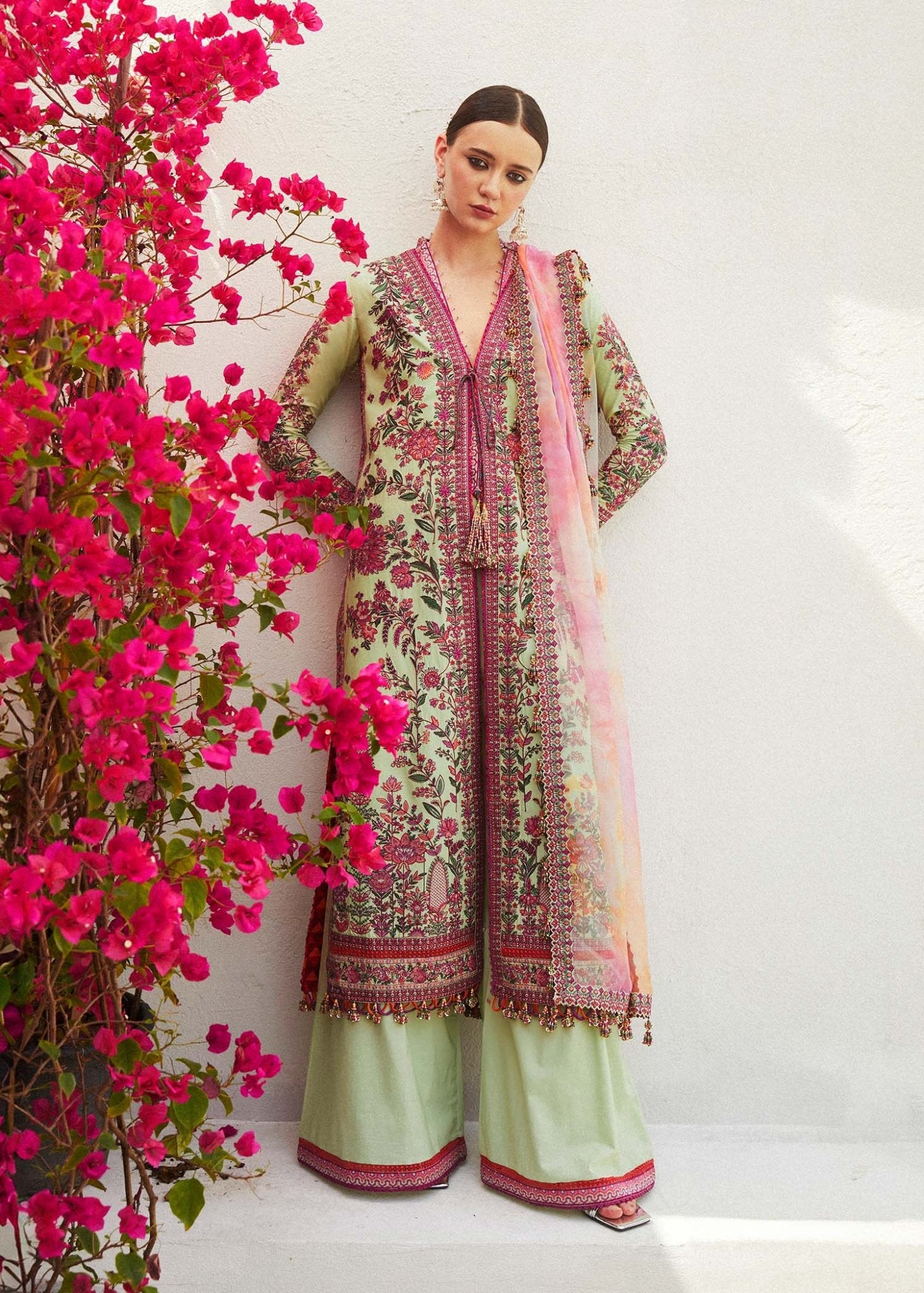 Model wearing green EIRA dress from Hussain Rehar Eid Luxury Lawn SS/24. Pakistani clothes online UK. Floral print and intricate embroidery.