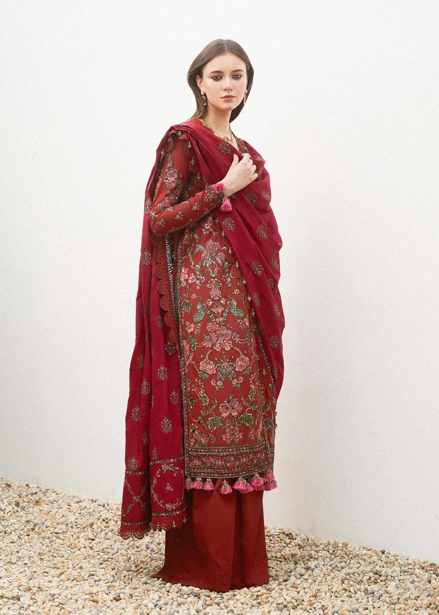 Model wearing a red RUHI dress from Hussain Rehar's Eid Luxury Lawn SS/24 collection. showcasing Pakistani clothes online UK.