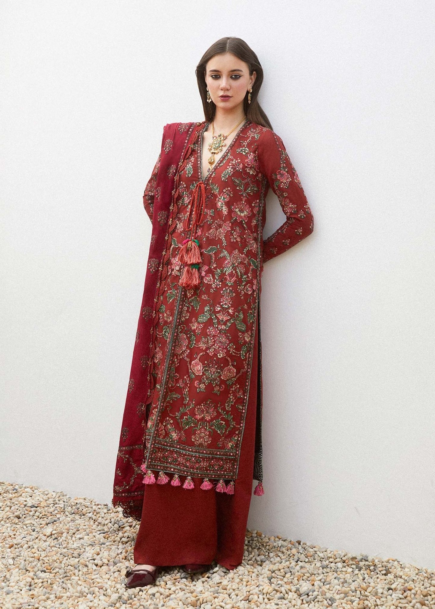 Model wearing a red RUHI dress from Hussain Rehar's Eid Luxury Lawn SS/24 collection. showcasing Pakistani clothes online UK.