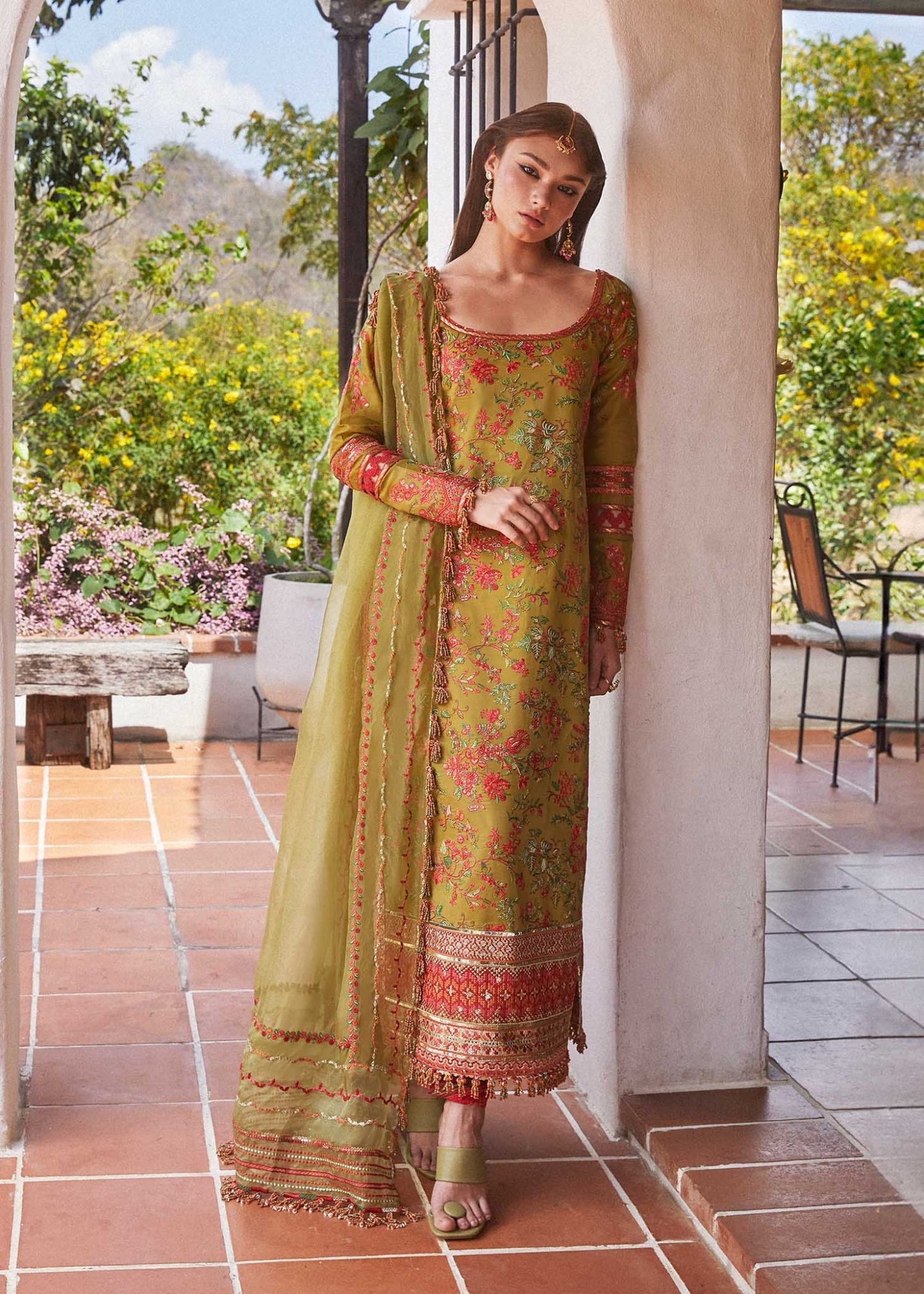 Model wearing a green SORBET dress from Hussain Rehar's Eid Luxury Lawn SS/24 collection. Pakistani clothes online UK. Floral embroidery.