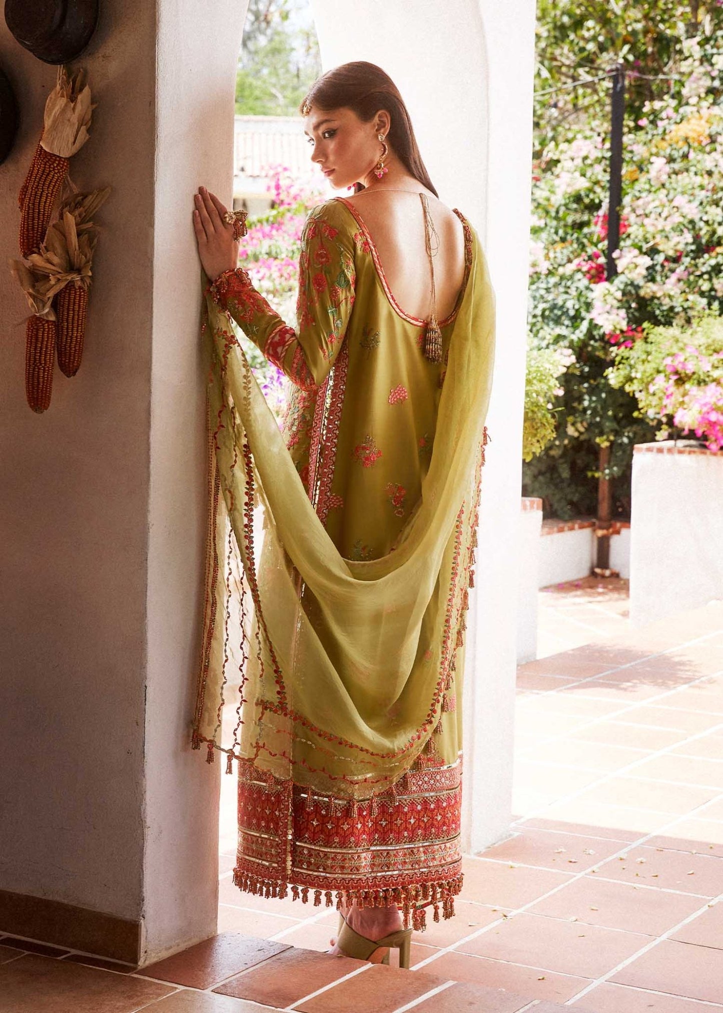 Model wearing a green SORBET dress from Hussain Rehar's Eid Luxury Lawn SS/24 collection. Pakistani clothes online UK. Floral embroidery.