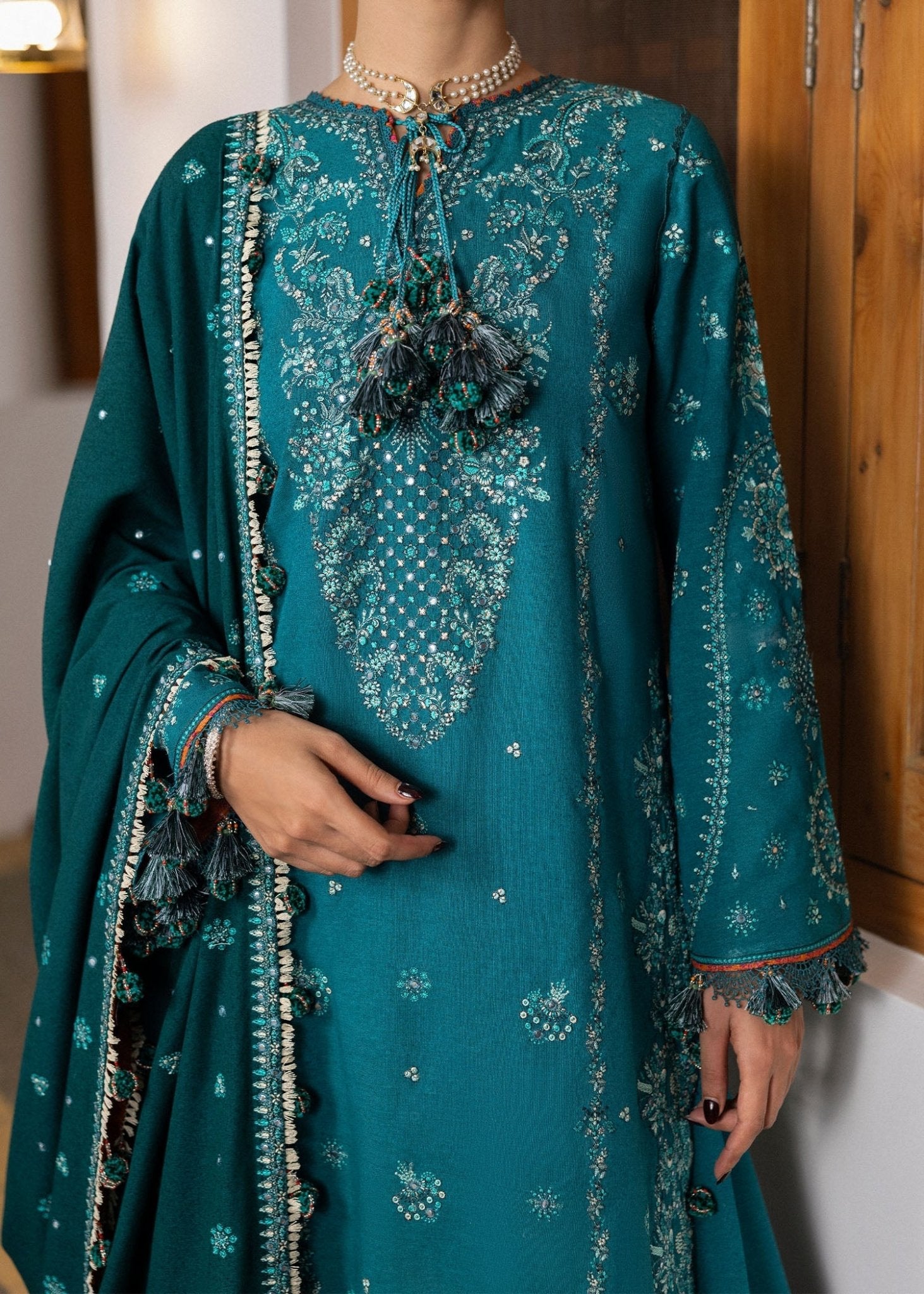 Model wearing Durk from Hussain Rehar's Karandi AW '24, showcasing luxury Pakistani clothes online in UK.