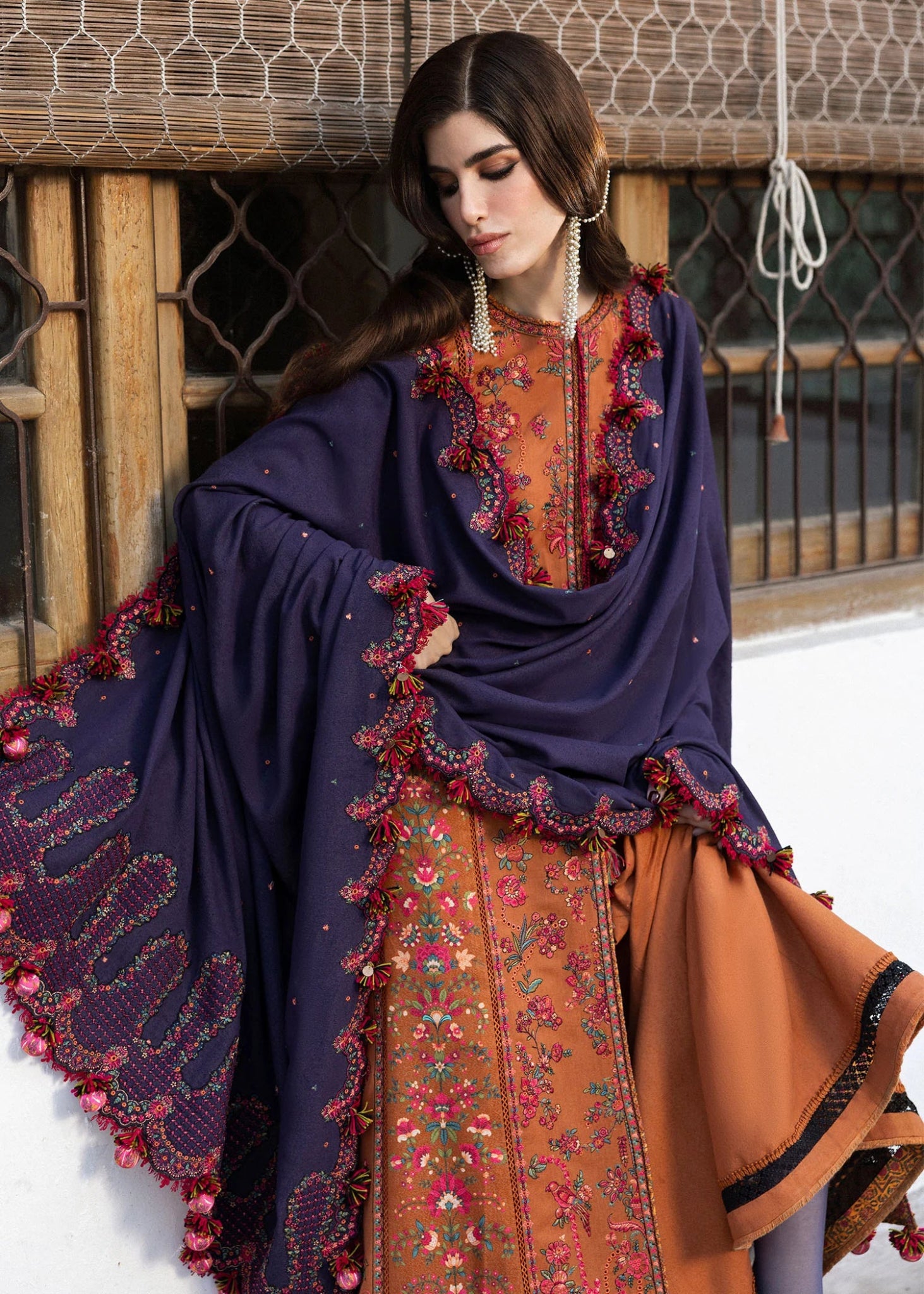 Model wearing Kamal from Hussain Rehar's Karandi AW '24, showcasing luxury Pakistani clothes online in UK.