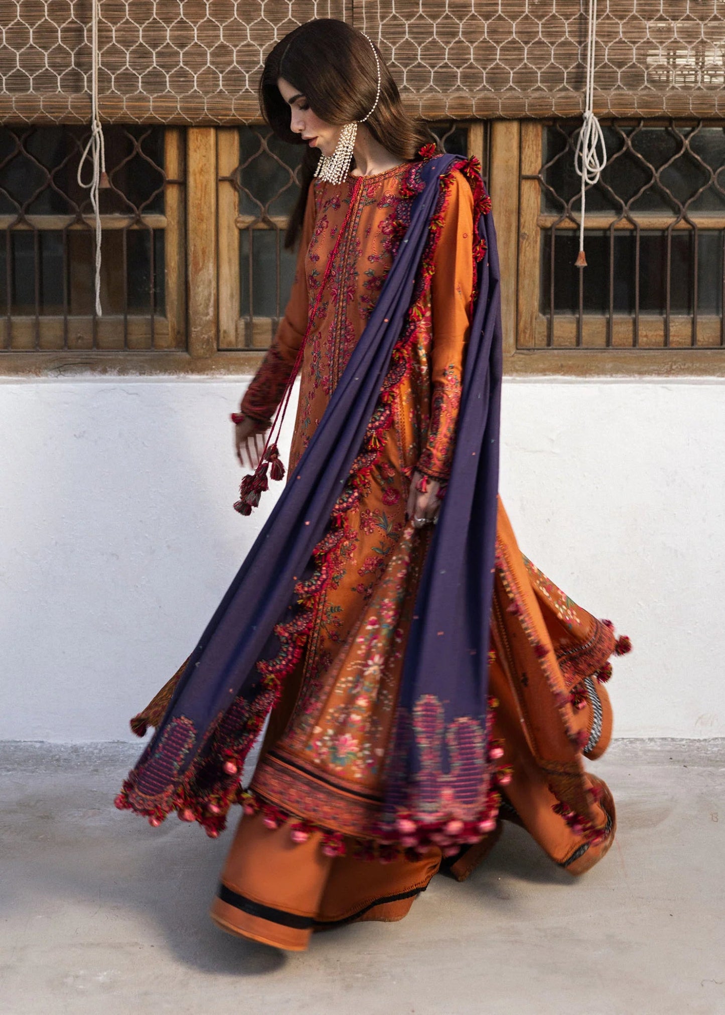 Model wearing Kamal from Hussain Rehar's Karandi AW '24, showcasing luxury Pakistani clothes online in UK.