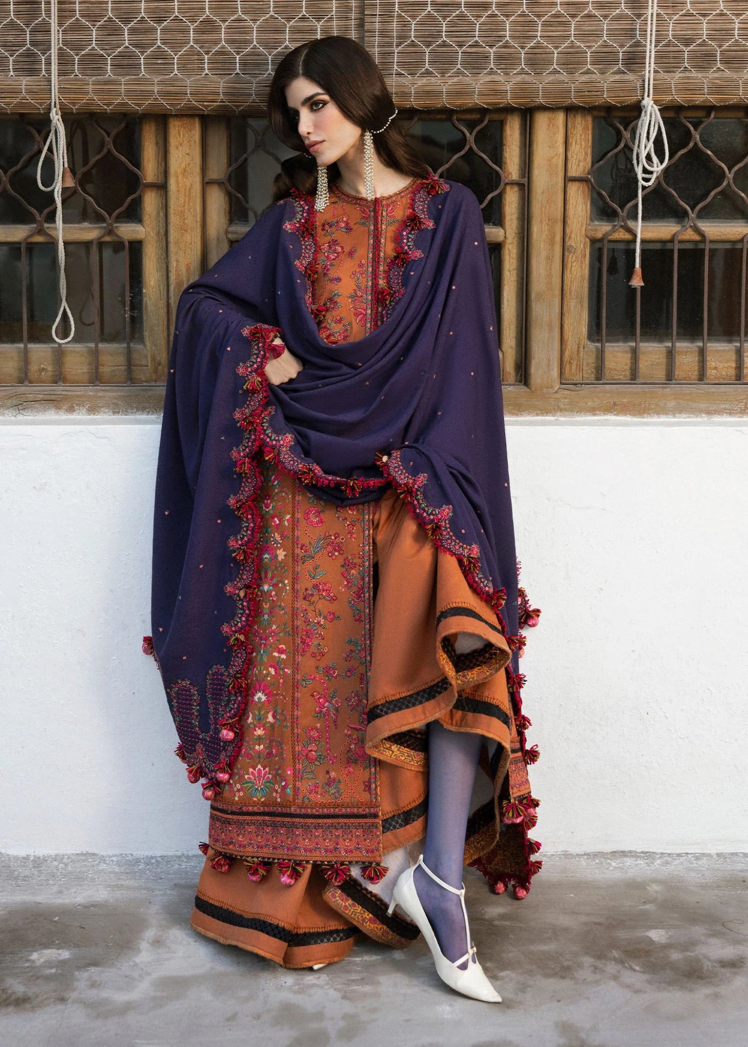 Model wearing Kamal from Hussain Rehar's Karandi AW '24, showcasing luxury Pakistani clothes online in UK.