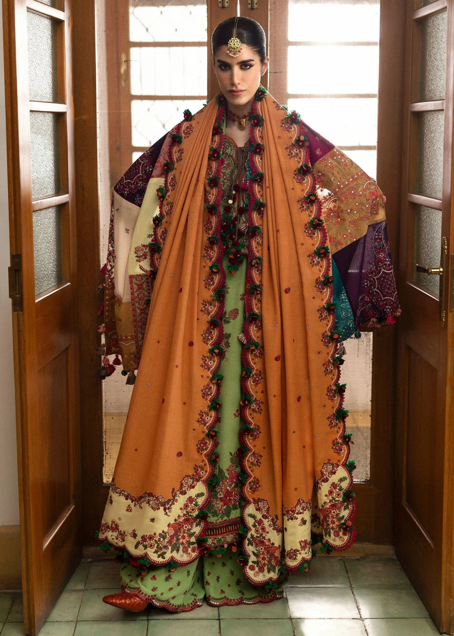 Model wearing Mosy from Hussain Rehar's Karandi AW '24 collection, showcasing intricate patterns. Luxury Pakistani clothes online in UK.