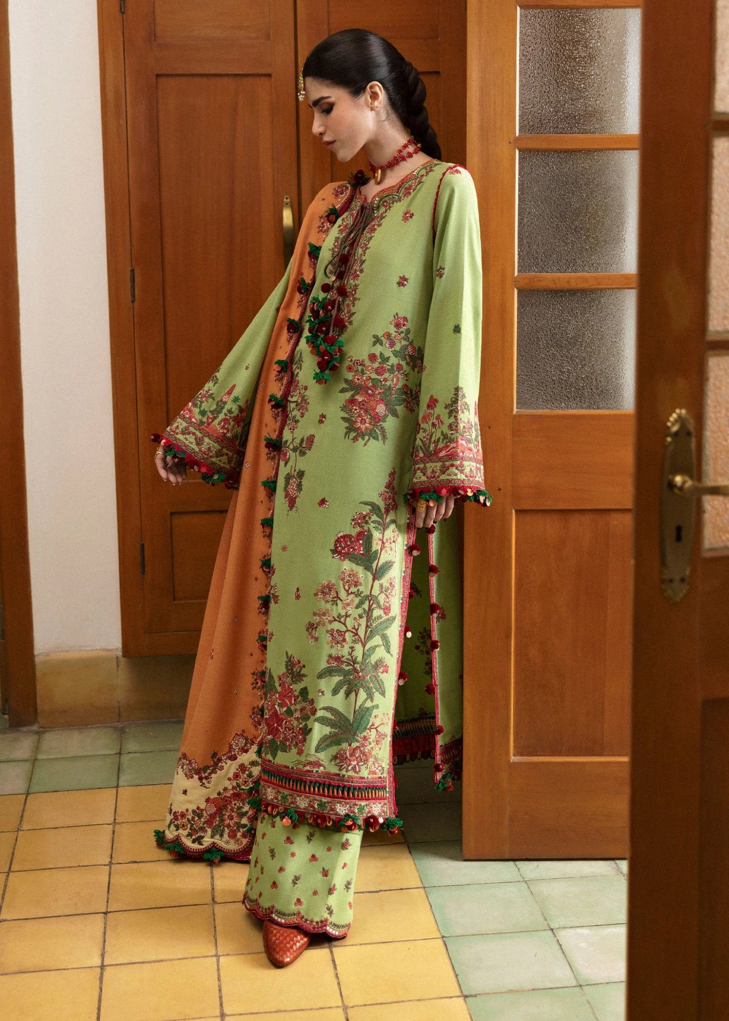 Model wearing Mosy from Hussain Rehar's Karandi AW '24 collection, showcasing intricate patterns. Luxury Pakistani clothes online in UK.