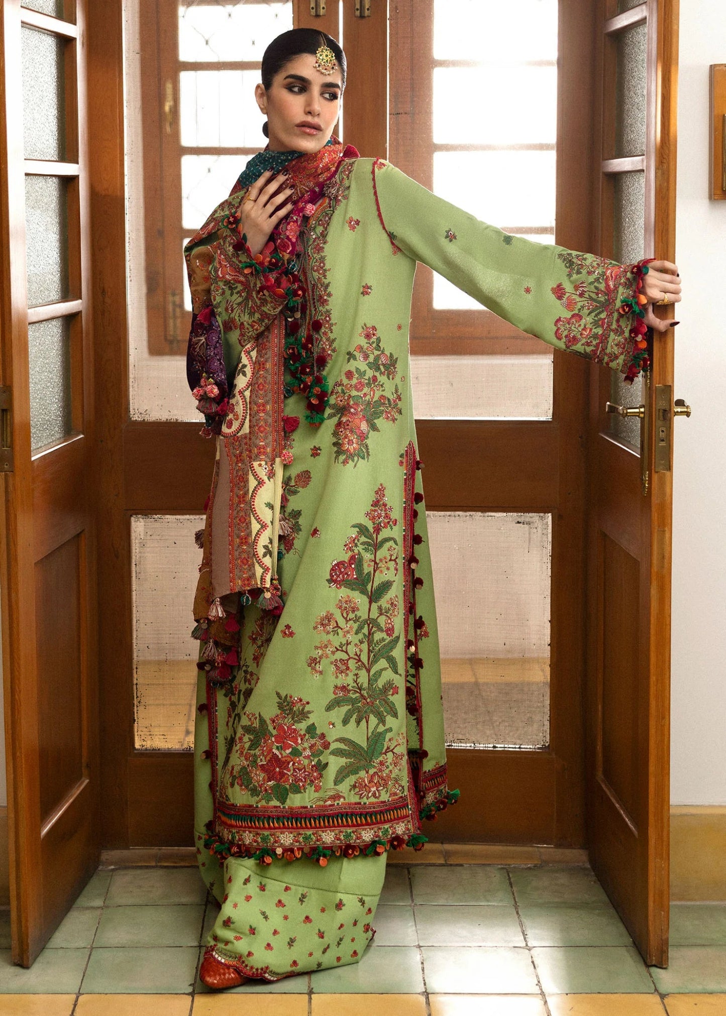 Model wearing Mosy from Hussain Rehar's Karandi AW '24 collection, showcasing intricate patterns. Luxury Pakistani clothes online in UK.