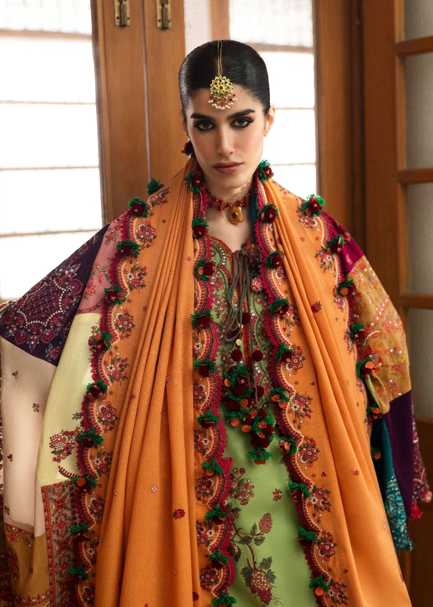 Model wearing Mosy from Hussain Rehar's Karandi AW '24 collection, showcasing intricate patterns. Luxury Pakistani clothes online in UK.