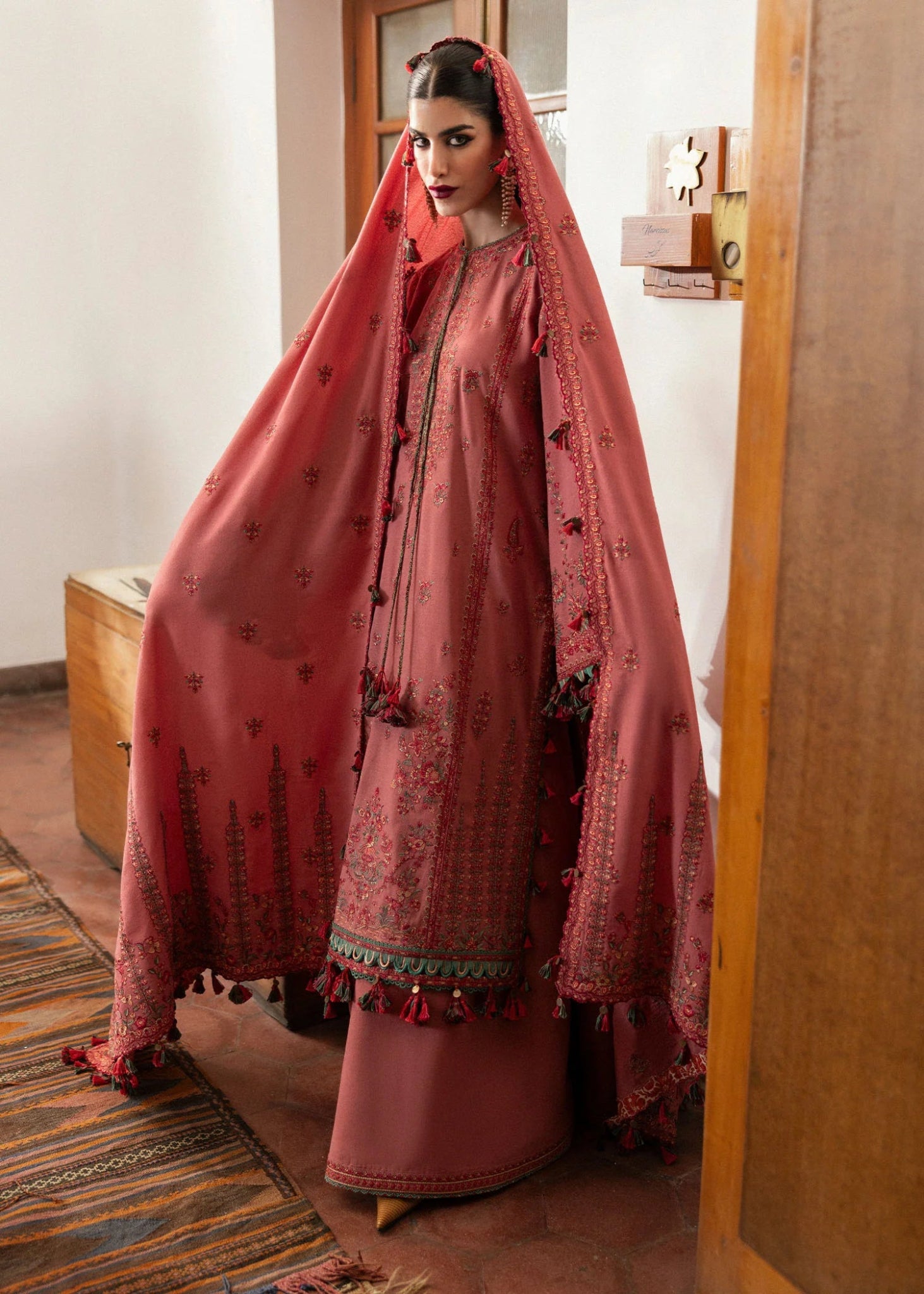 Model wearing Tulle from Hussain Rehar's Karandi AW '24, showcasing luxury Pakistani clothes online in UK.