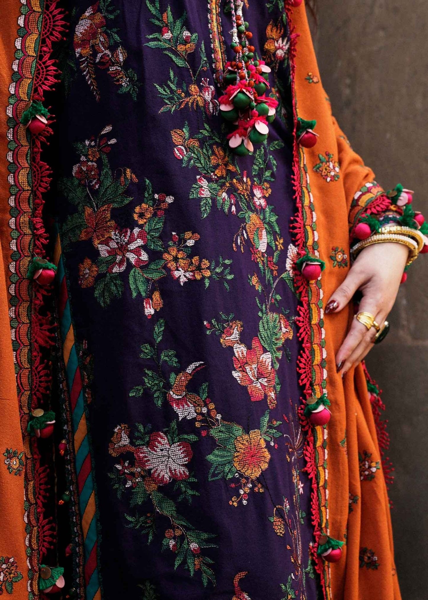 Model wearing Hussain Rehar Karandi Aw'23 Amethyst dress in navy with orange dupatta, showcasing Pakistani clothes online in the UK.