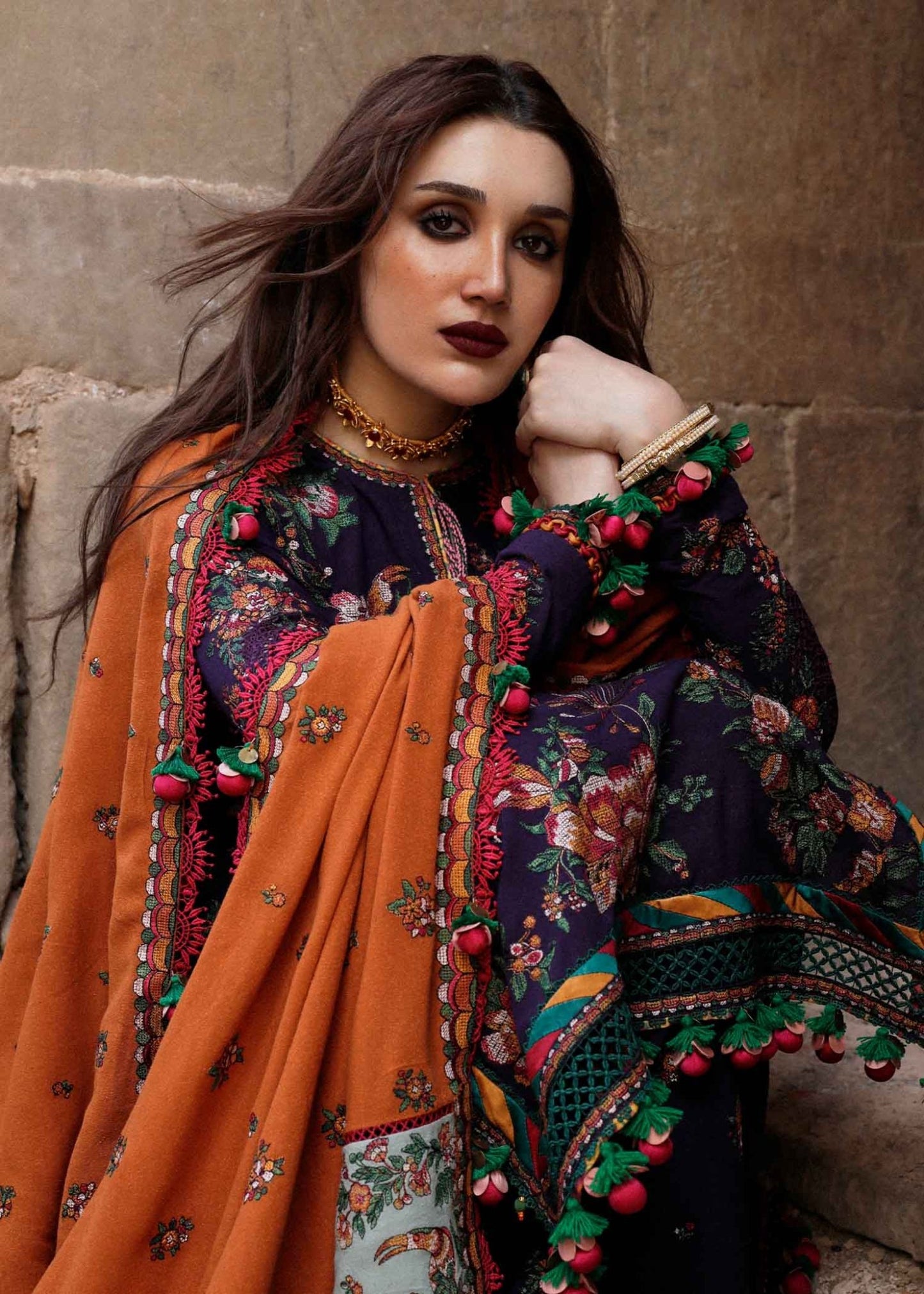 Model wearing Hussain Rehar Karandi Aw'23 Amethyst dress in navy with orange dupatta, showcasing Pakistani clothes online in the UK.