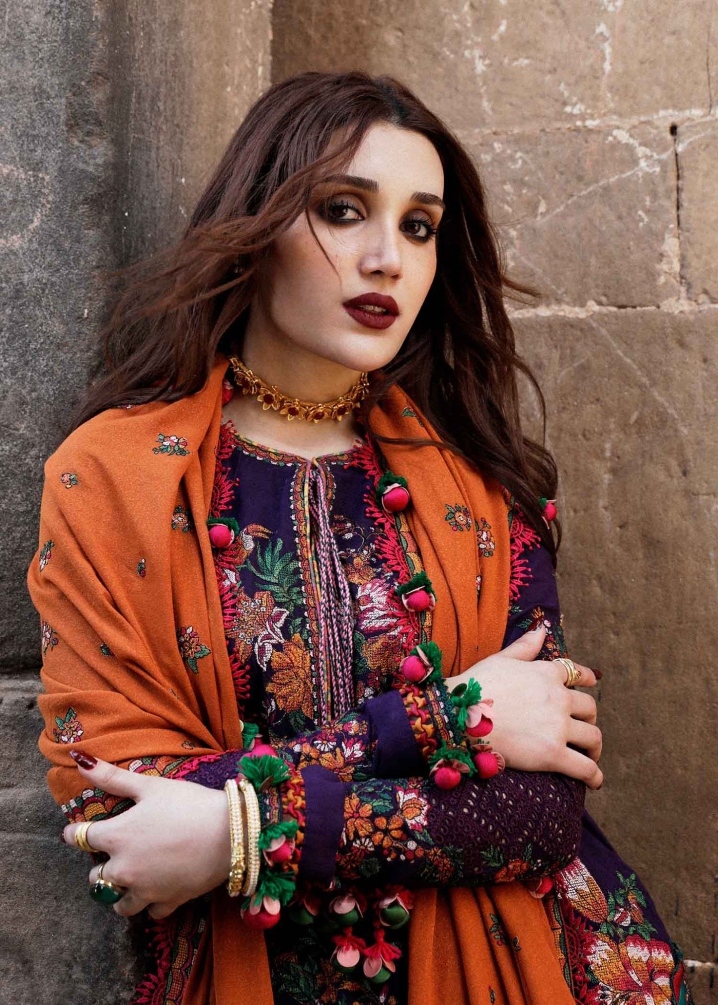 Model wearing Hussain Rehar Karandi Aw'23 Amethyst dress in navy with orange dupatta, showcasing Pakistani clothes online in the UK.