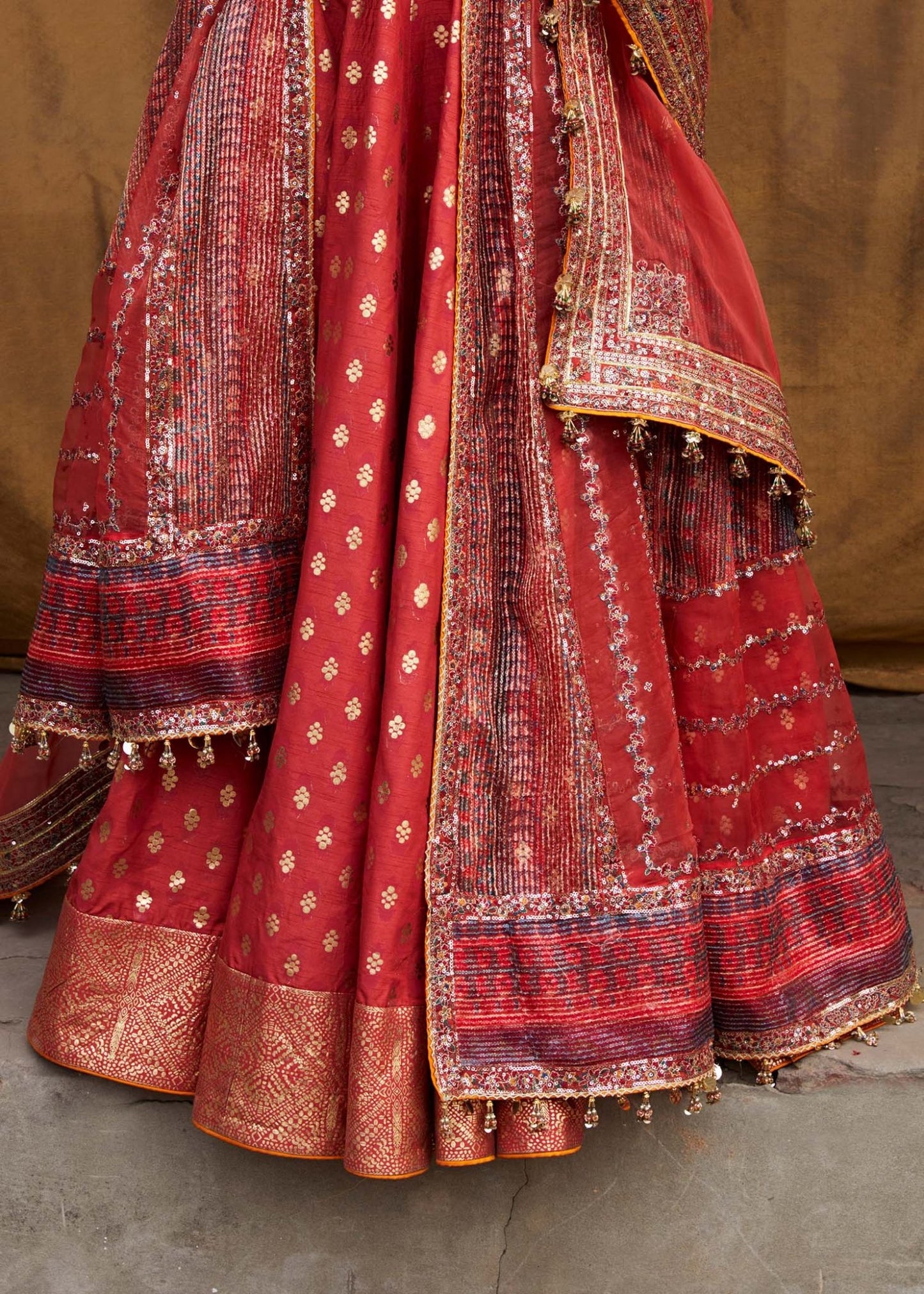 Model wearing red Bulori dress from Hussain Rehar Luxury Festive FW/24, featuring intricate embroidery and embellishments. Pakistani clothes online in the UK.