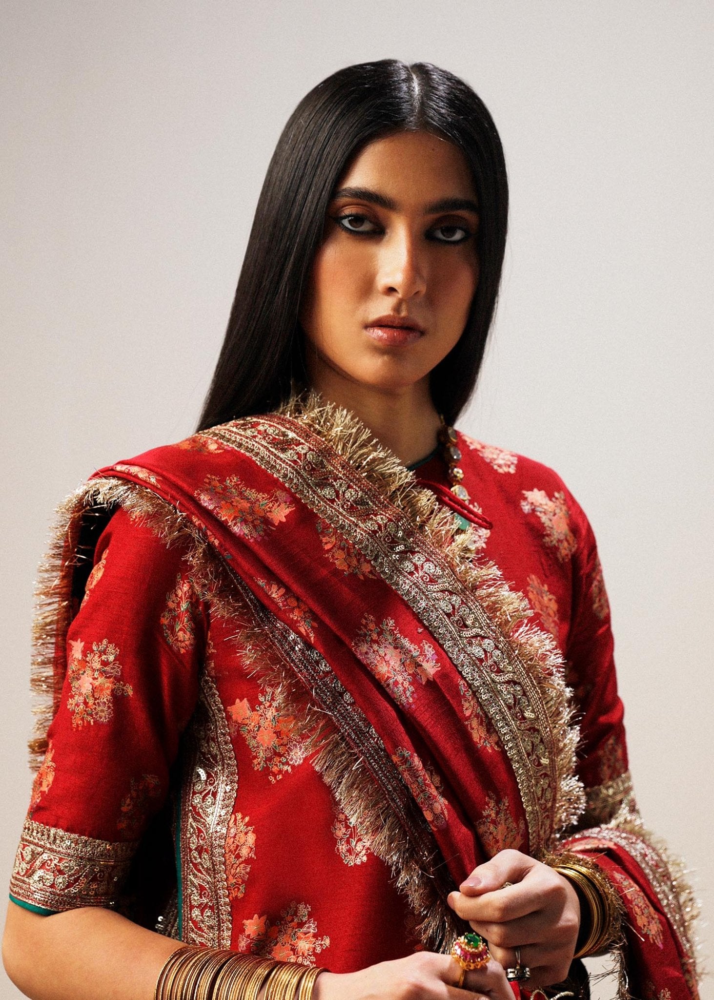 Model wearing red Sahar dress from Hussain Rehar Luxury Pret A/W 2024, showcasing Pakistani clothes online in the UK.