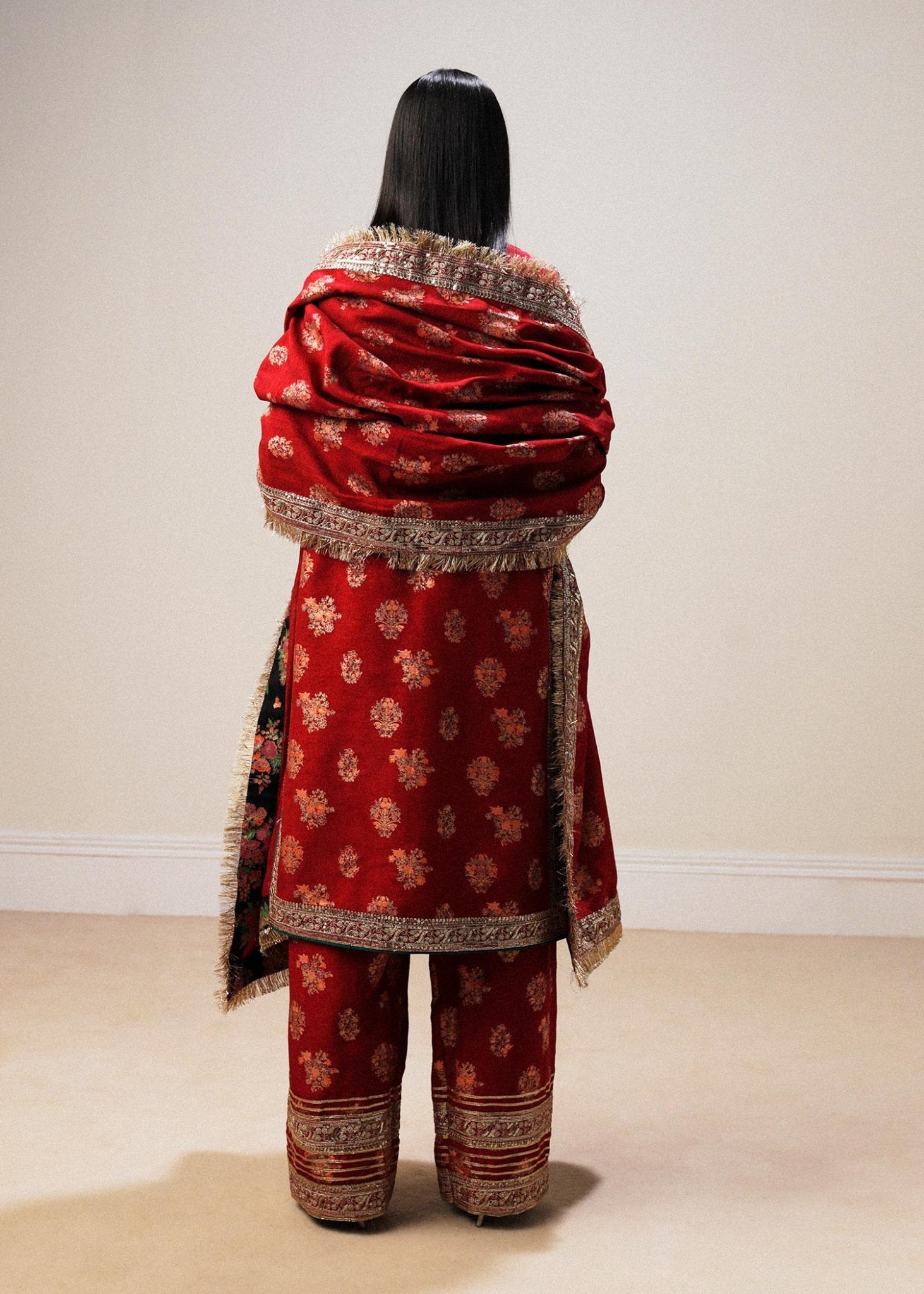 Model wearing red Sahar dress from Hussain Rehar Luxury Pret A/W 2024, showcasing Pakistani clothes online in the UK.