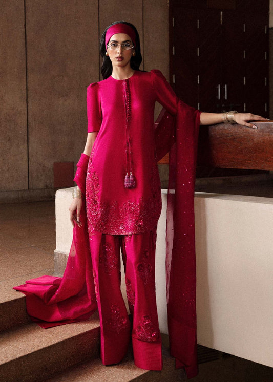 Model wearing a vibrant pink Cerise dress from Hussain Rehar's Luxury Pret Eid '24 collection. Pakistani clothes online in UK.