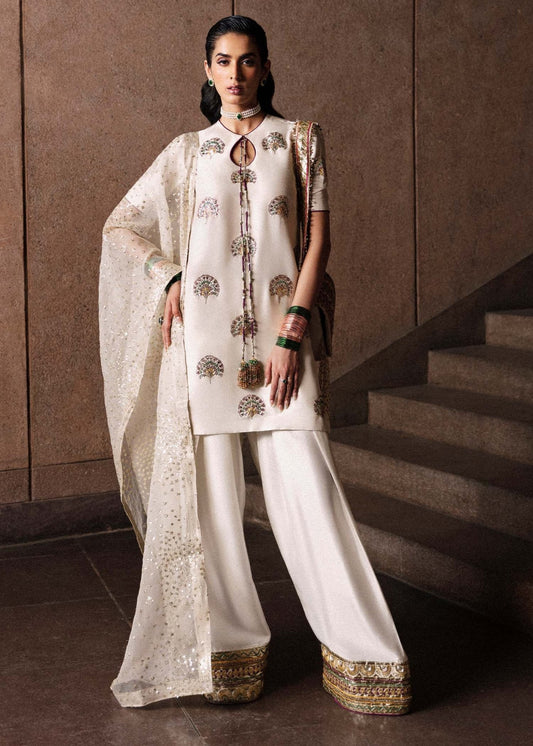 Model wearing Hussain Rehar Lin dress in elegant white, ideal for Pakistani designer clothes in UK, readymade wedding clothes, showcasing luxury details for Eid '24.