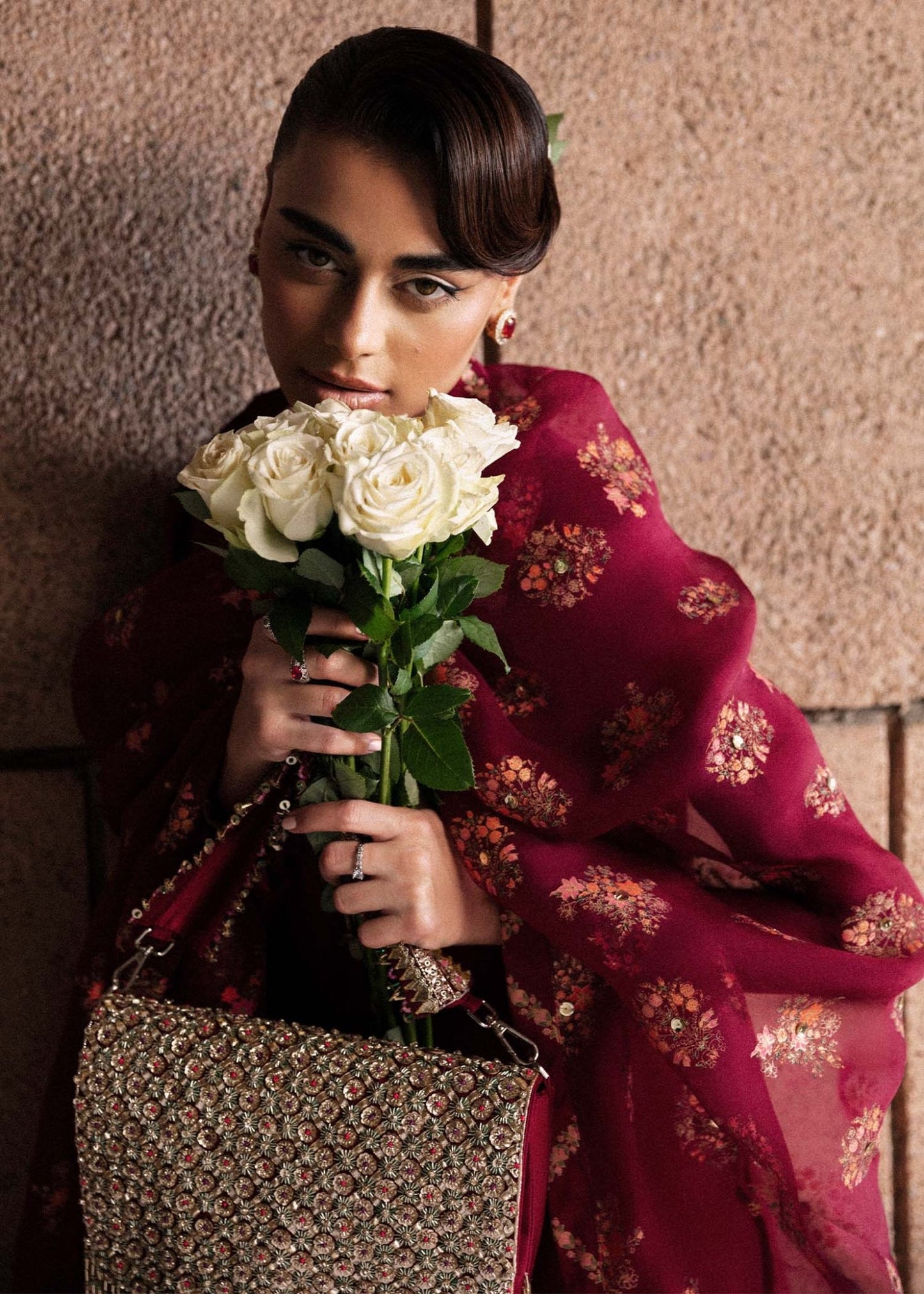 Model wearing an exquisite maroon Merlot dress from Hussain Rehar's Luxury Pret Eid '24 collection. Pakistani clothes online in UK.