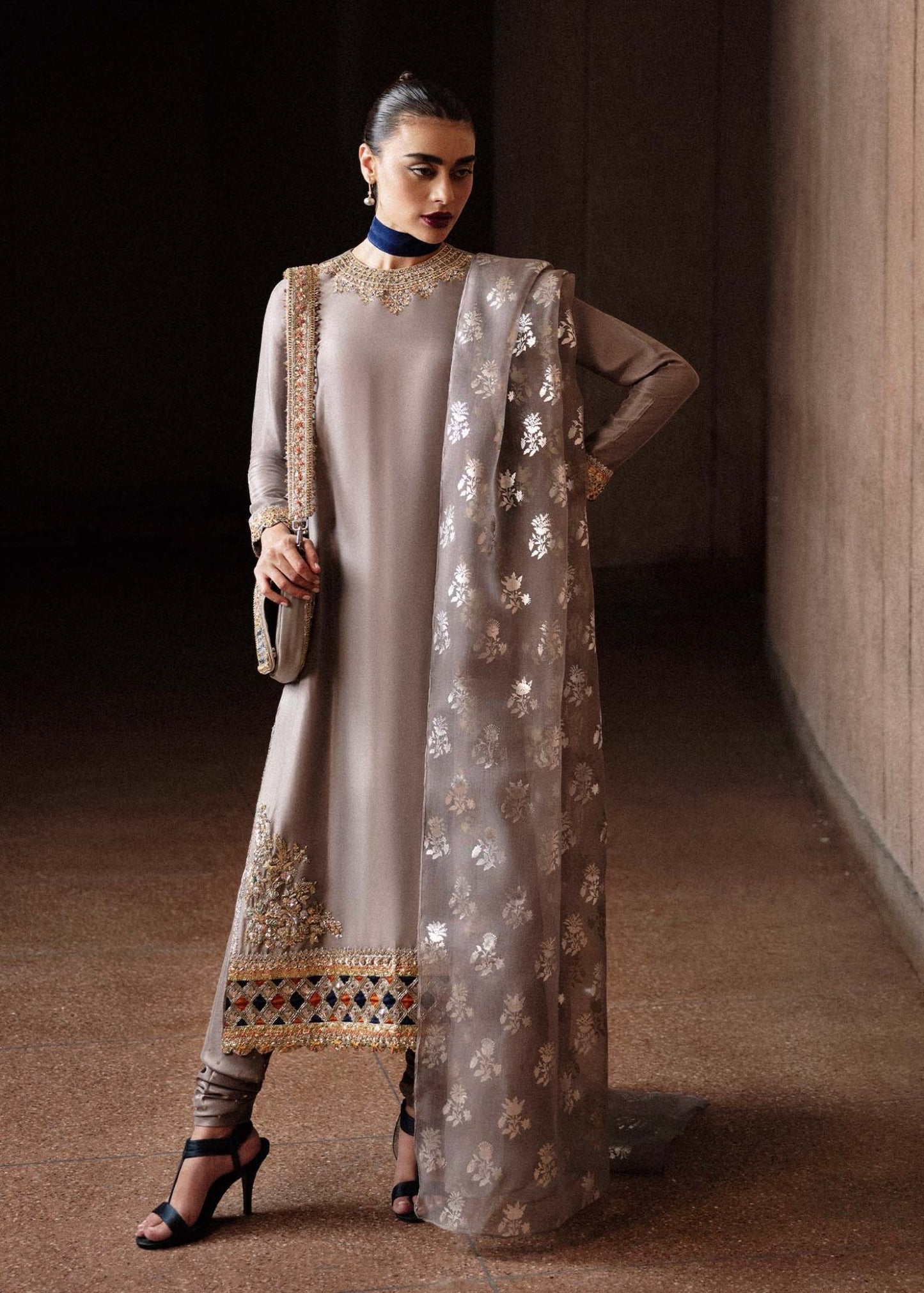 Model wearing a grey Mist dress with intricate embroidery from Hussain Rehar's Luxury Pret Eid '24 collection. Pakistani clothes online in UK.