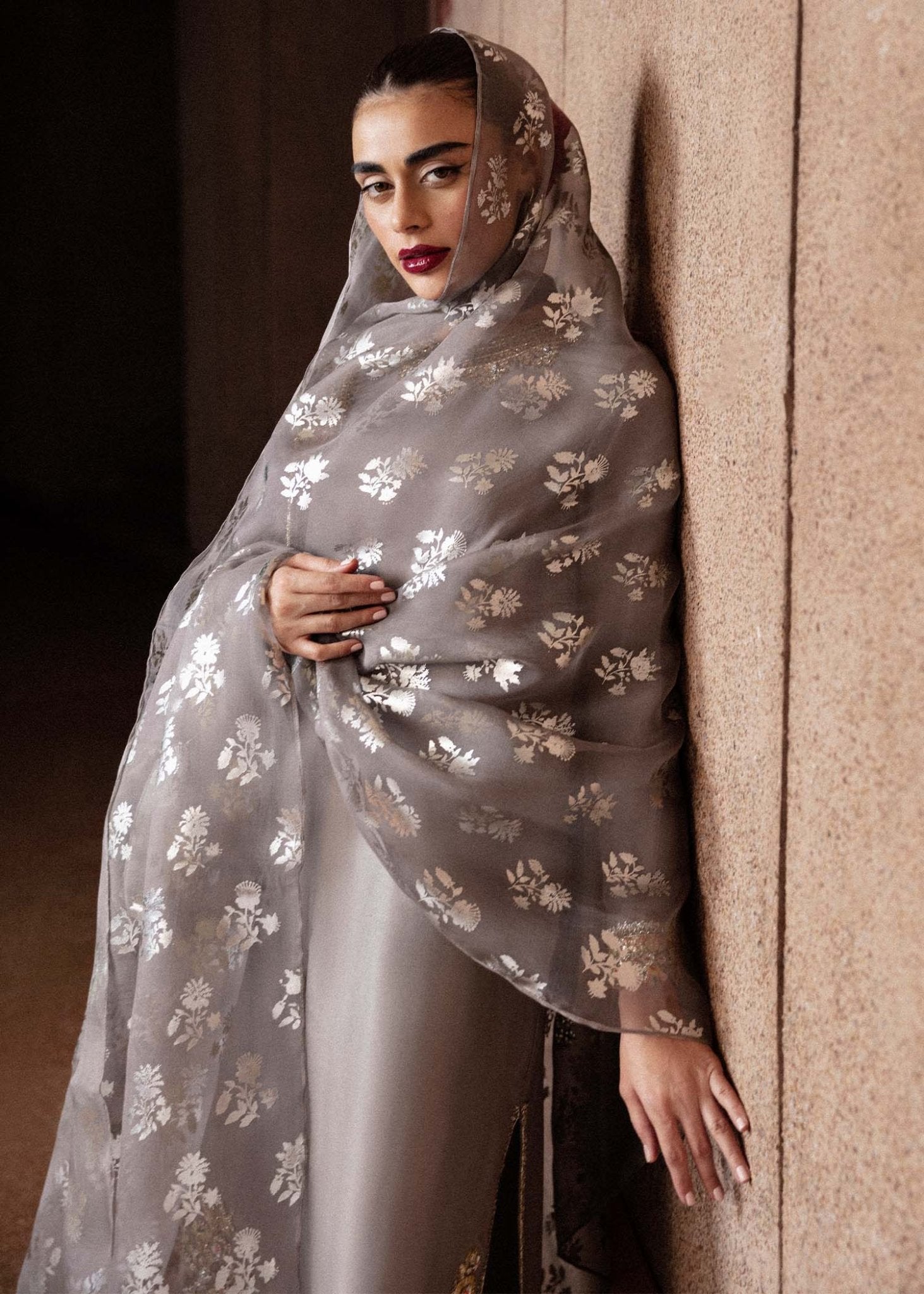 Model wearing a grey Mist dress with intricate embroidery from Hussain Rehar's Luxury Pret Eid '24 collection. Pakistani clothes online in UK.