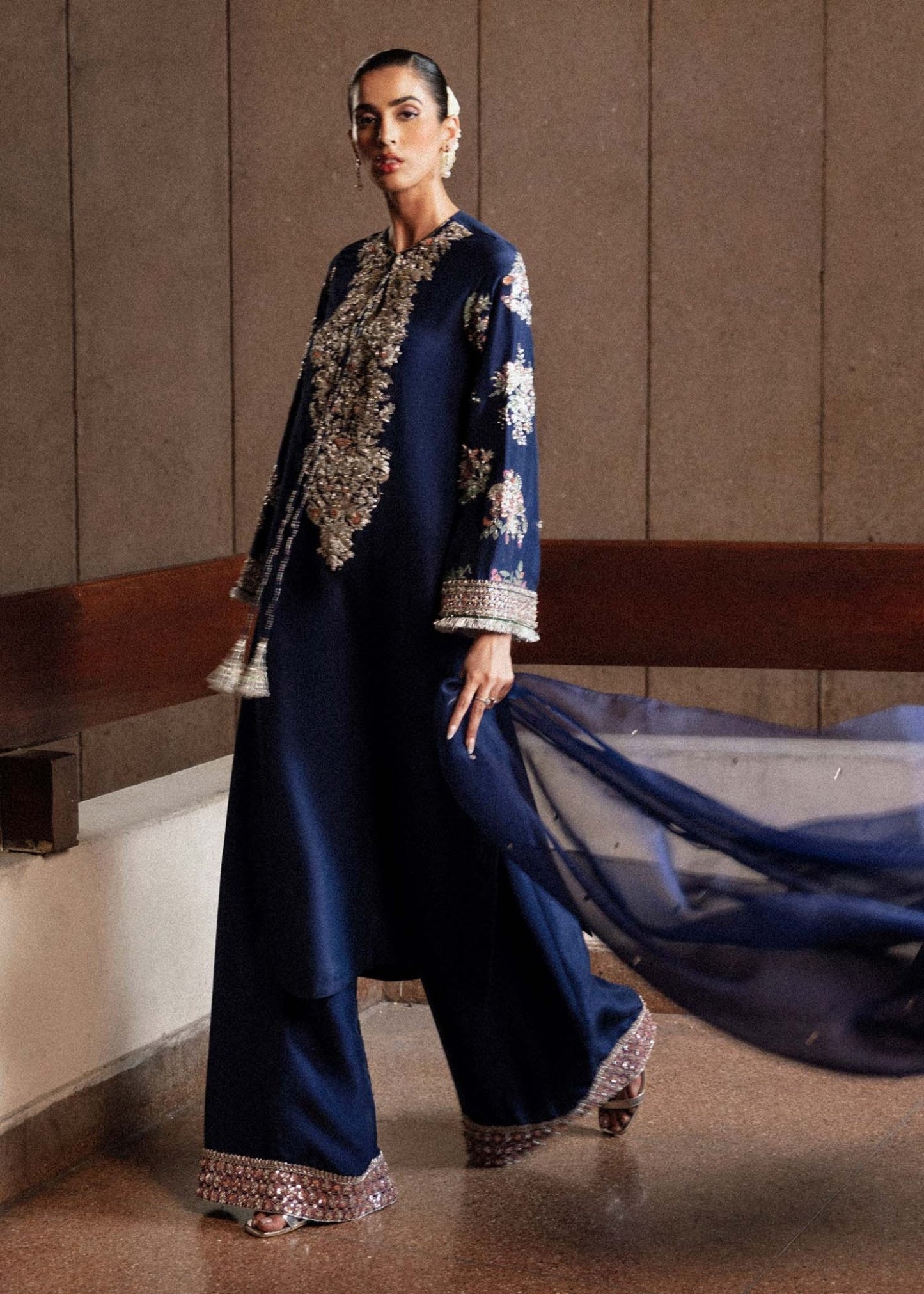 Model wearing a navy blue Saxe dress from Hussain Rehar's Luxury Pret Eid '24 collection. Pakistani clothes online in UK.