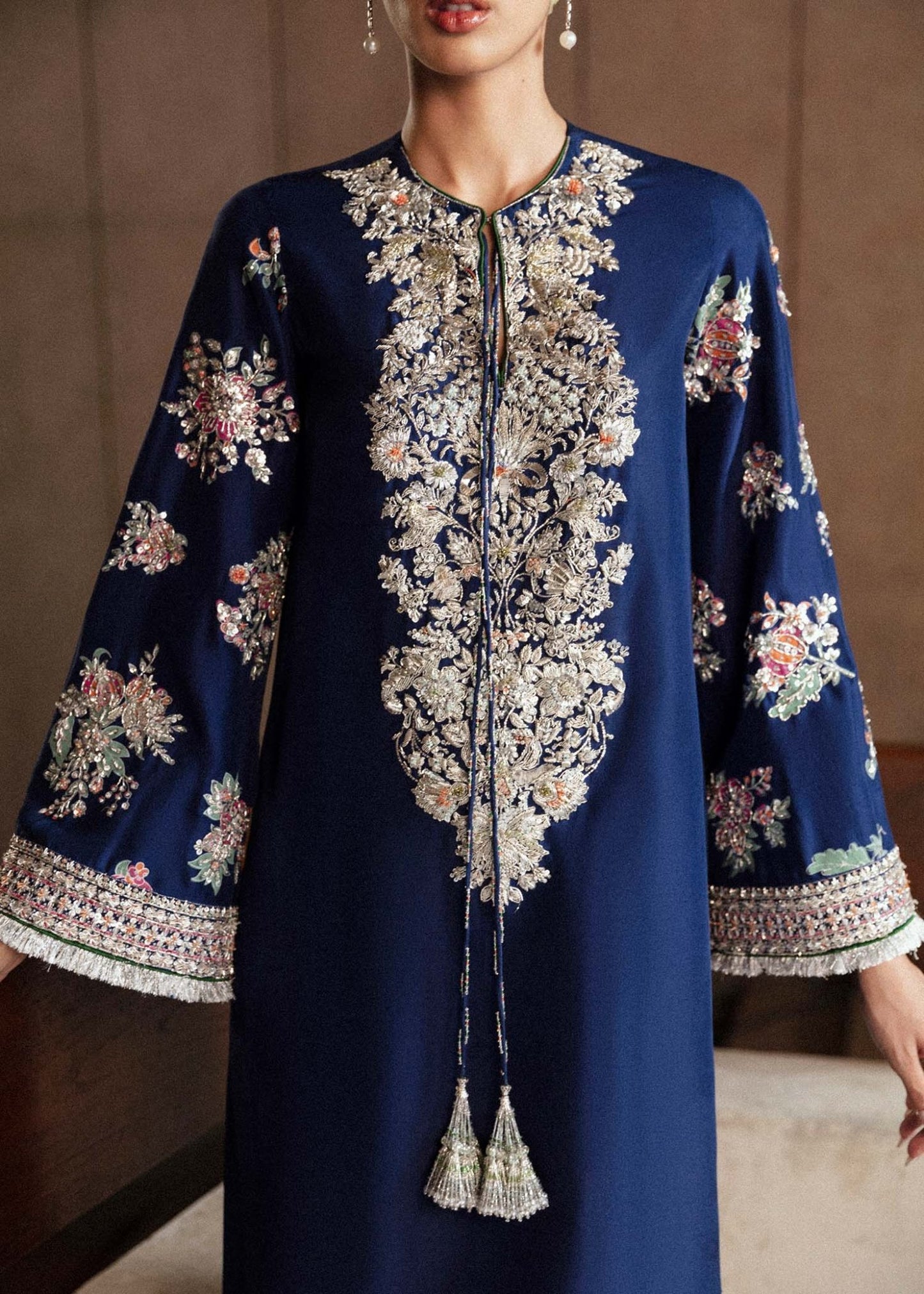 Model wearing a navy blue Saxe dress from Hussain Rehar's Luxury Pret Eid '24 collection. Pakistani clothes online in UK.