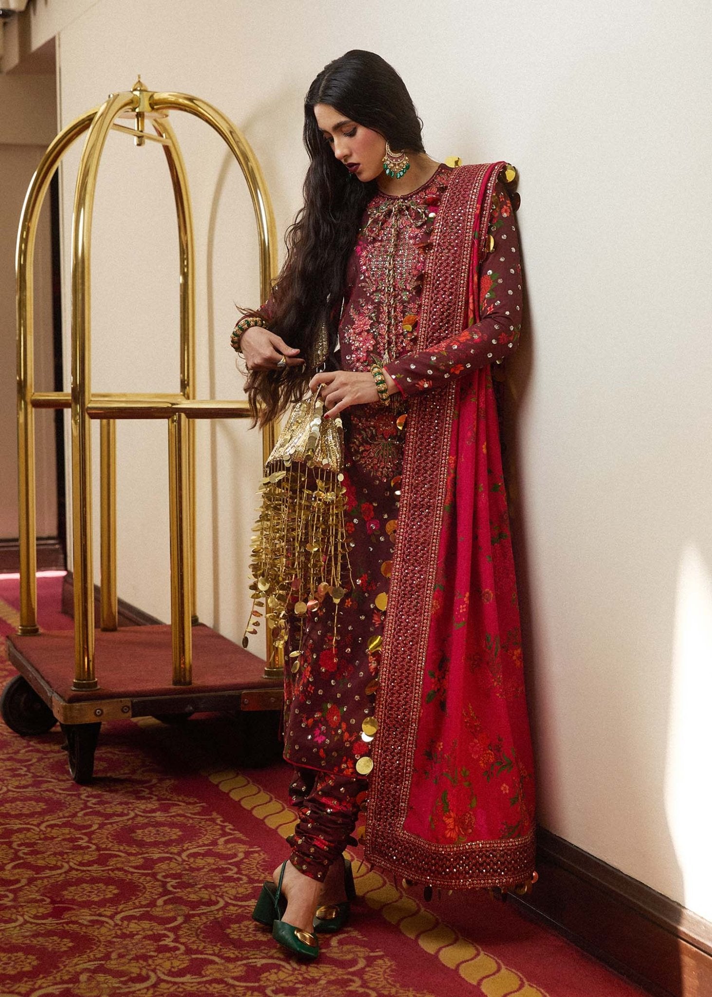 Model wearing a maroon Aabs dress from Hussain Rehar's Luxury Pret SS/24 collection. Pakistani clothes online in UK.