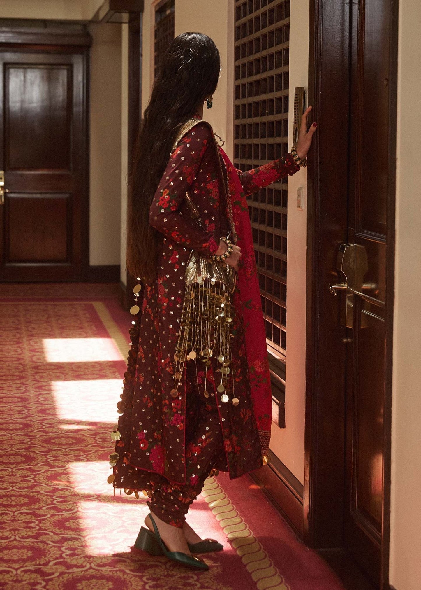 Model wearing a maroon Aabs dress from Hussain Rehar's Luxury Pret SS/24 collection. Pakistani clothes online in UK.