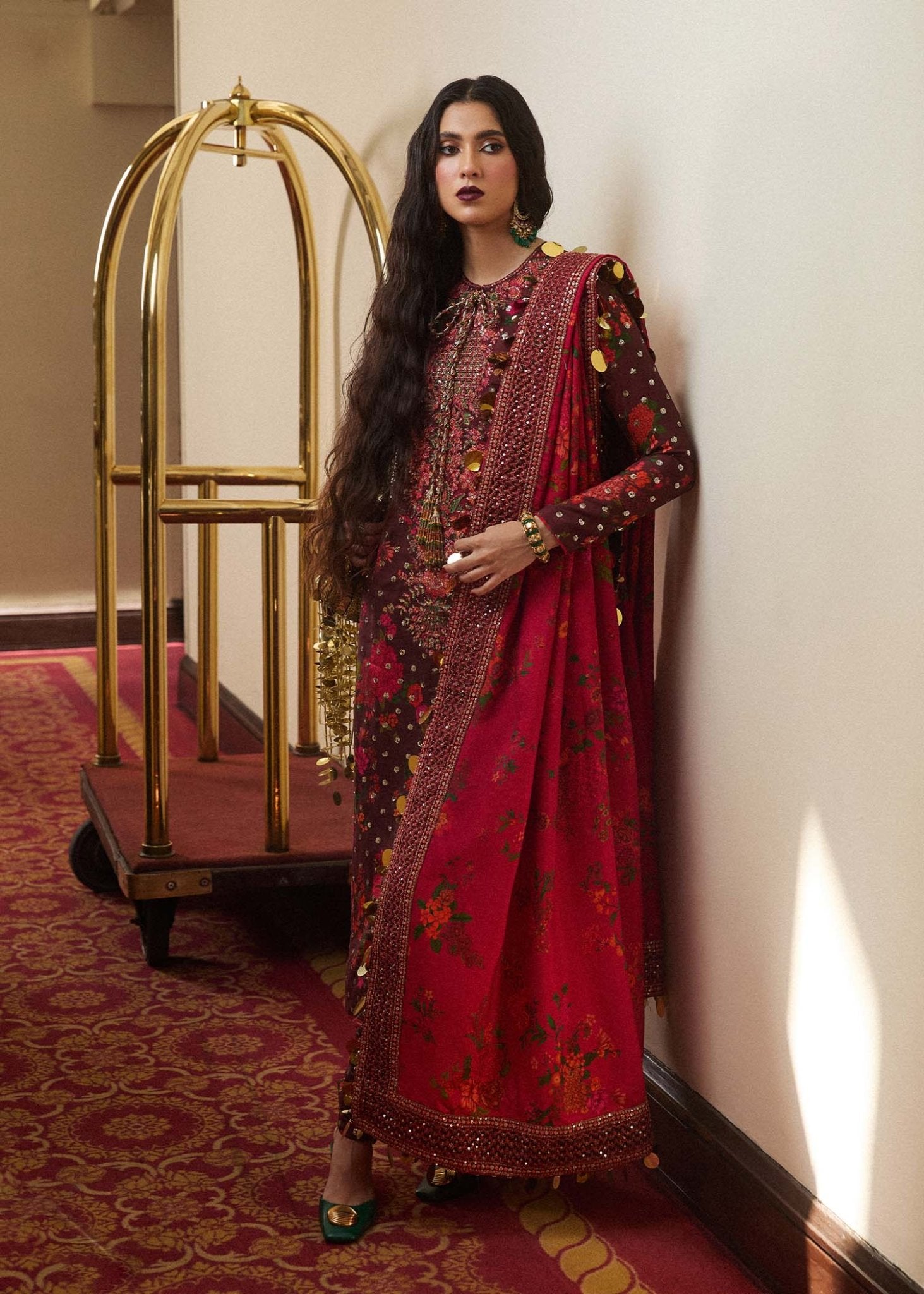 Model wearing a maroon Aabs dress from Hussain Rehar's Luxury Pret SS/24 collection. Pakistani clothes online in UK.