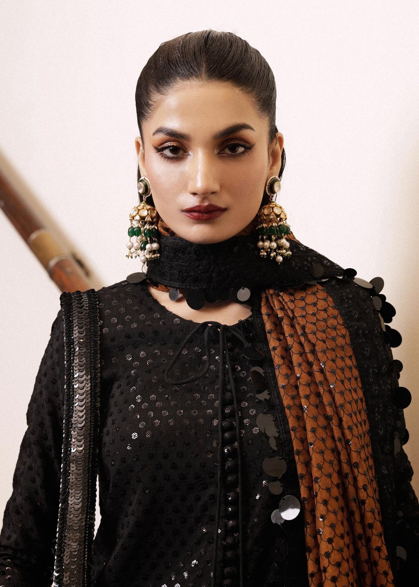 Model wearing a black Khaki dress from Hussain Rehar's Luxury Pret collection. Pakistani clothes online in UK.