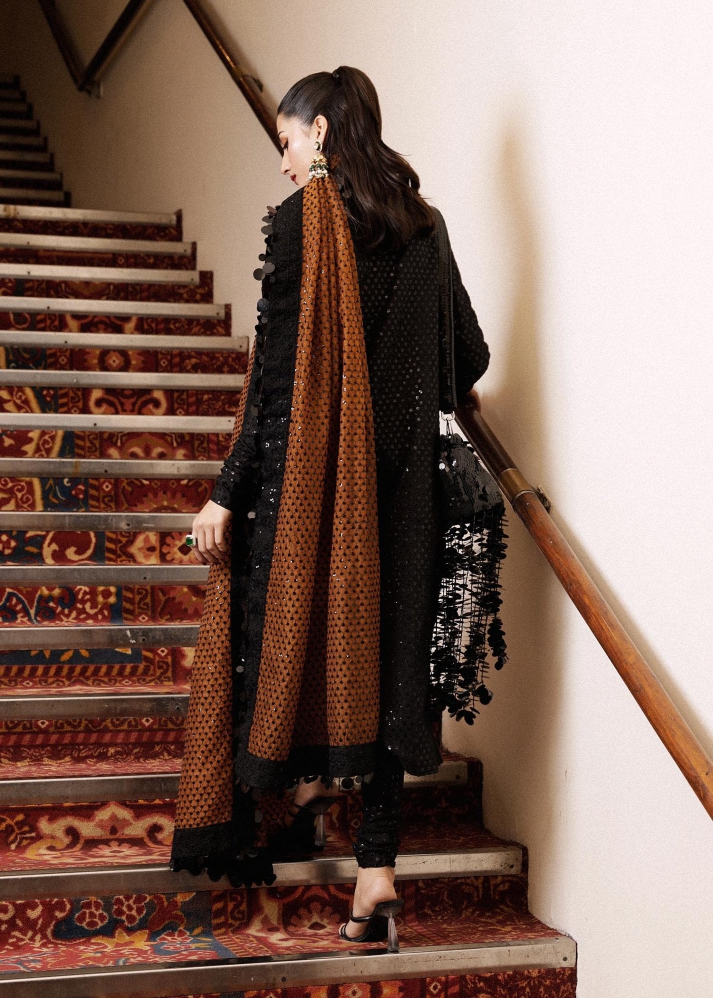 Model wearing a black Khaki dress from Hussain Rehar's Luxury Pret collection. Pakistani clothes online in UK.