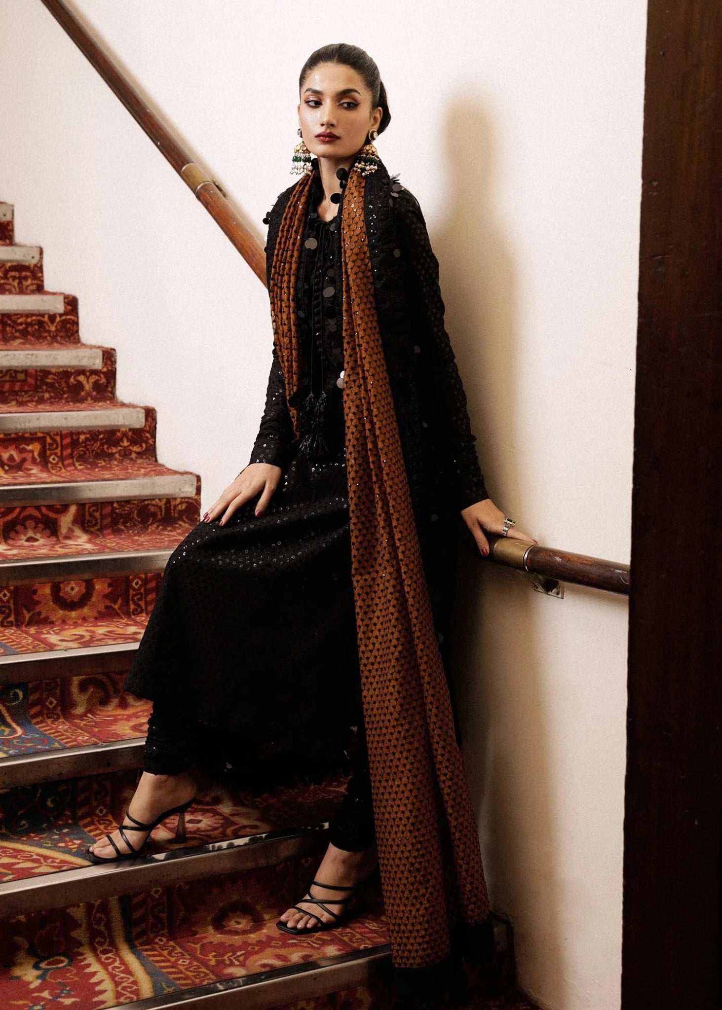 Model wearing a black Khaki dress from Hussain Rehar's Luxury Pret collection. Pakistani clothes online in UK.