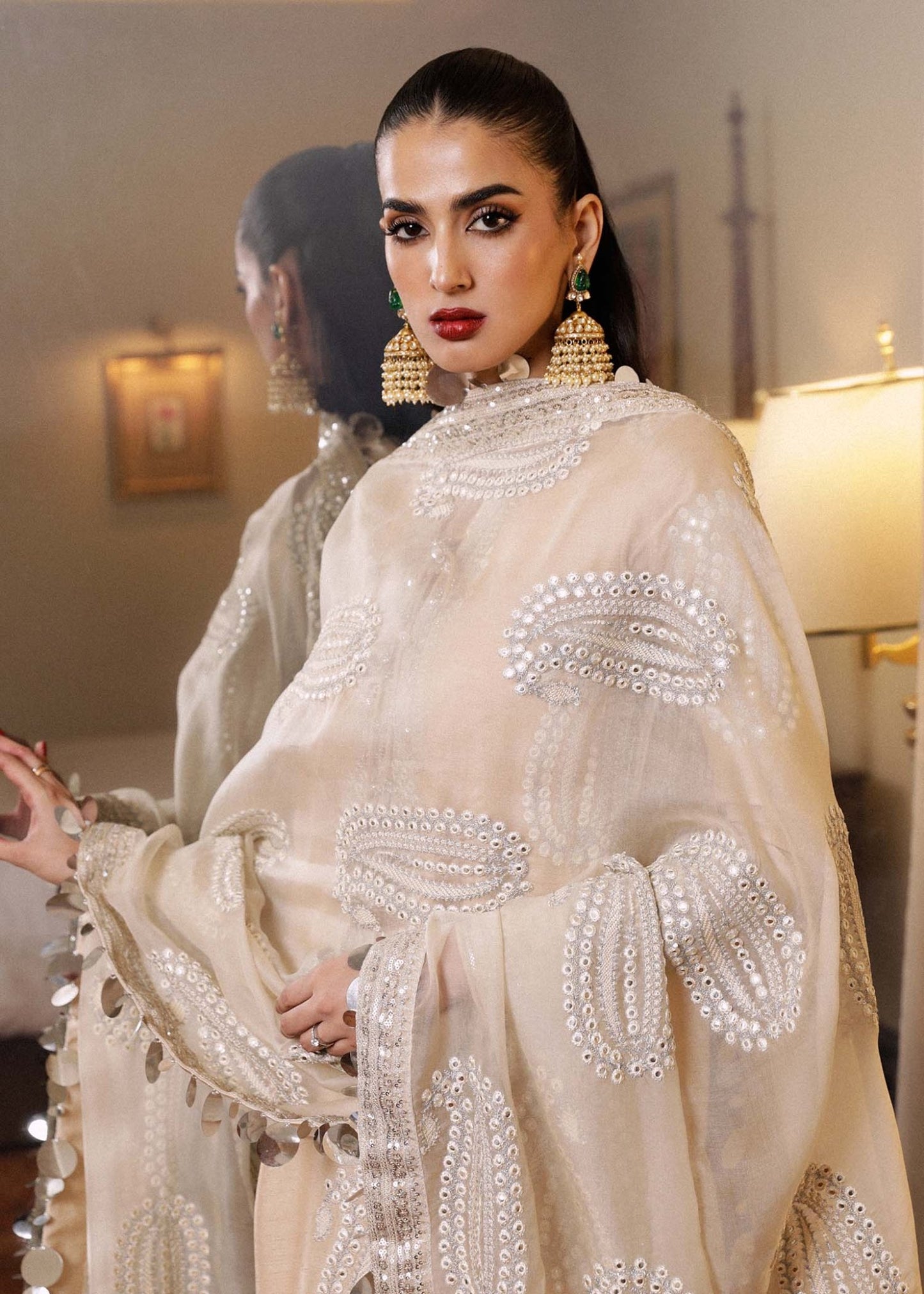 Model wearing a beige Moh dress from Hussain Rehar's Luxury Pret SS/24 collection. Pakistani clothes online in UK.